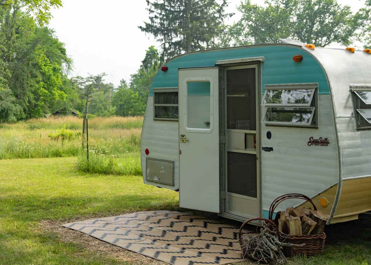 Tucked away camper under the shade