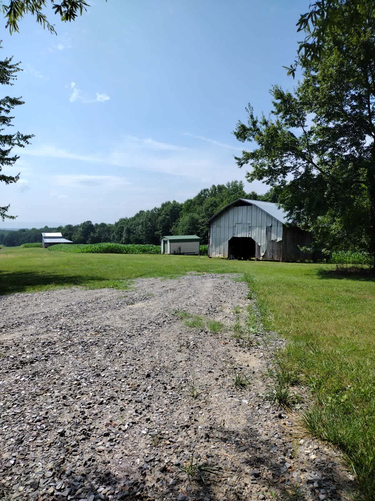 RV site facing barns and fields
