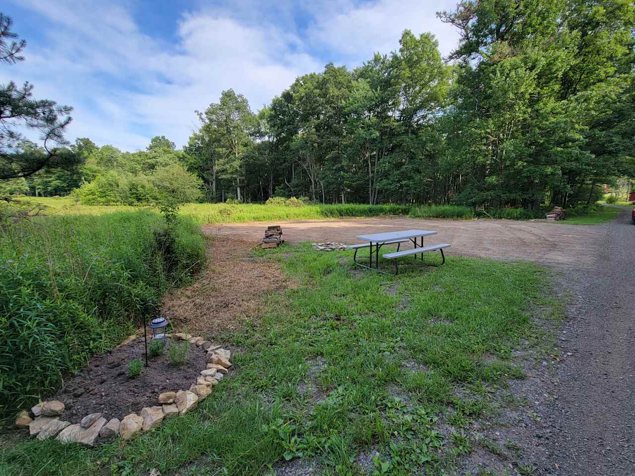 Fields edge site, left side of driveway 