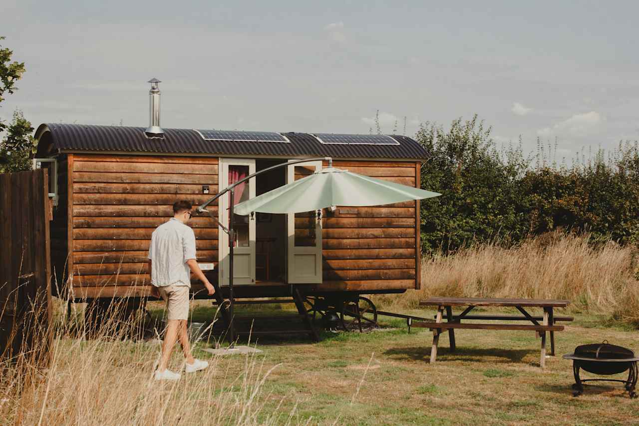 Exterior hut with picnic table and parasol