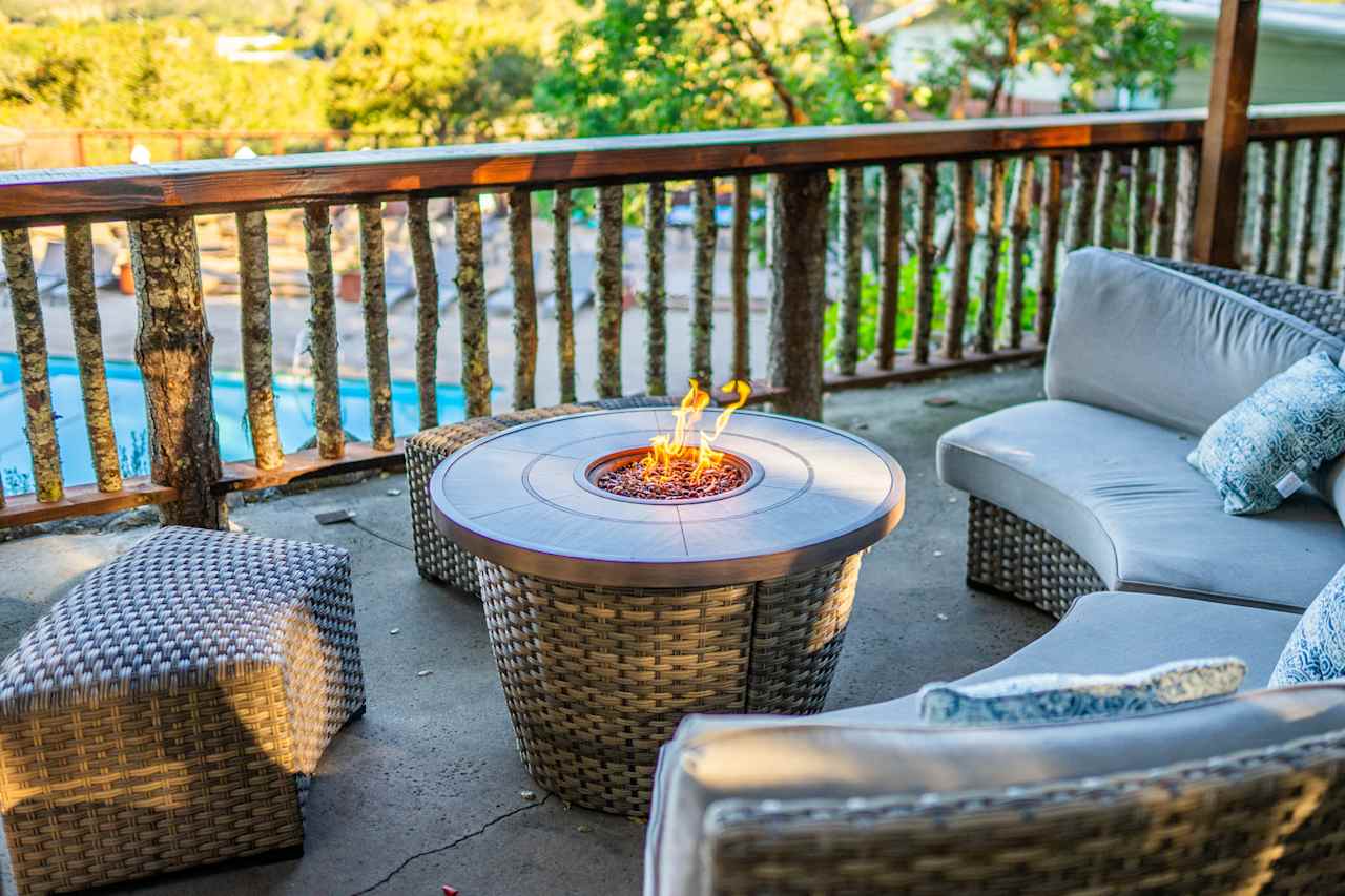 Common area with a firepit overlooking the pool!