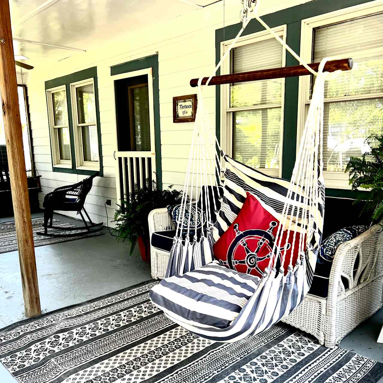 Porch swing is a perfect spot enjoy your time reading or chatting . 