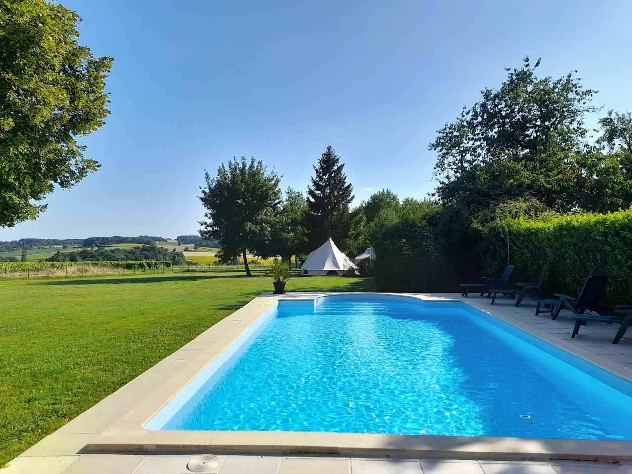 10 m x 5 m in-ground swimmimg pool. Open daily shared use with other glampers and campers