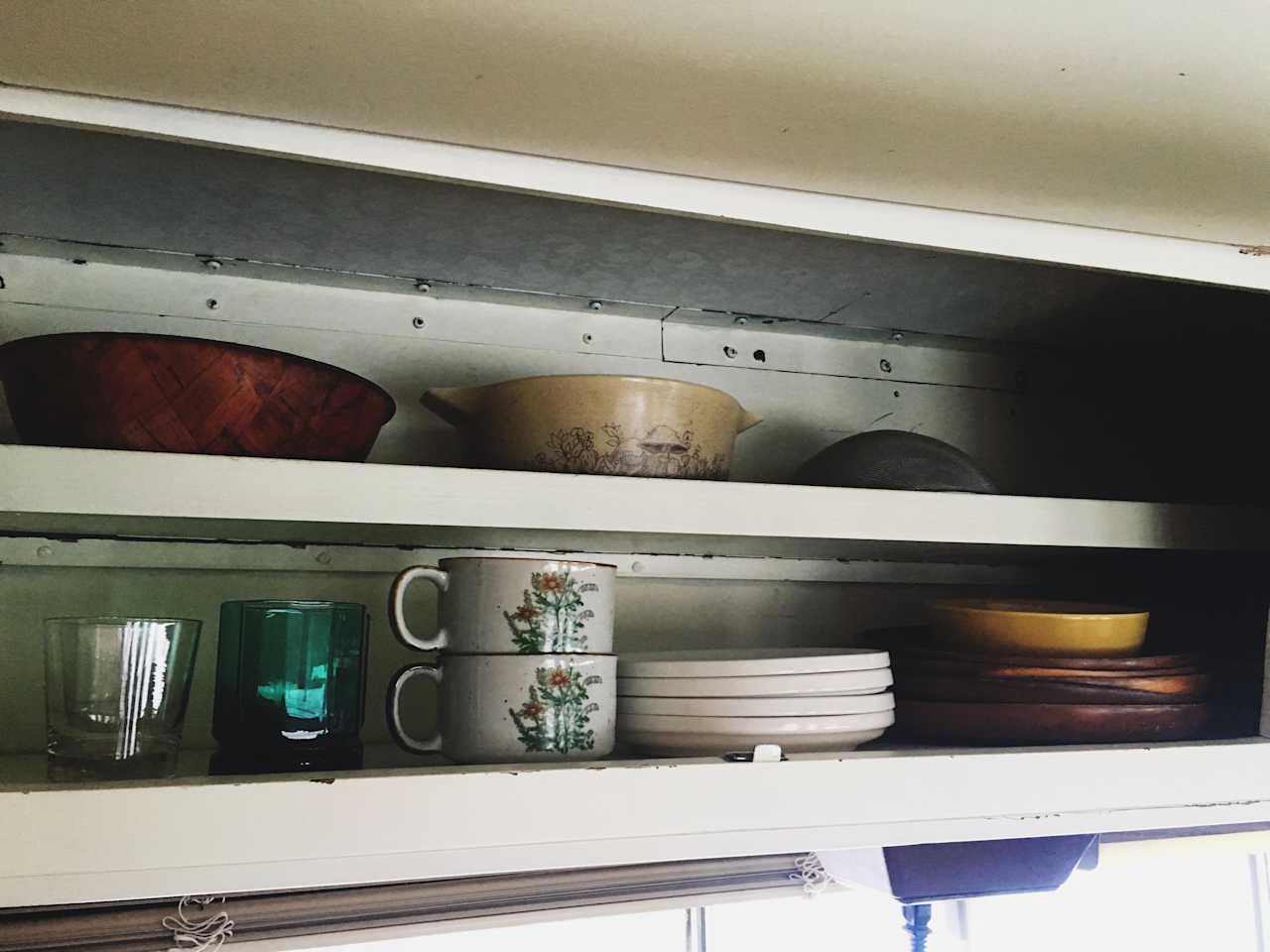 The pantry is stocked with necessities like grains, oils, seasonings, locally grown herbal teas, and more!