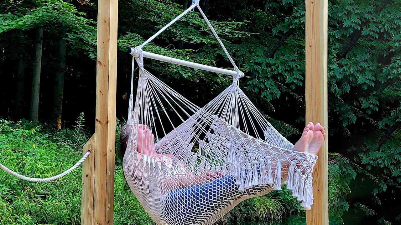 Nestled in a cozy hanging chair, you become part of the dock’s rhythm at Canvas Cottages. Frogs croak, dragonflies buzz & you're cradled by nature.
