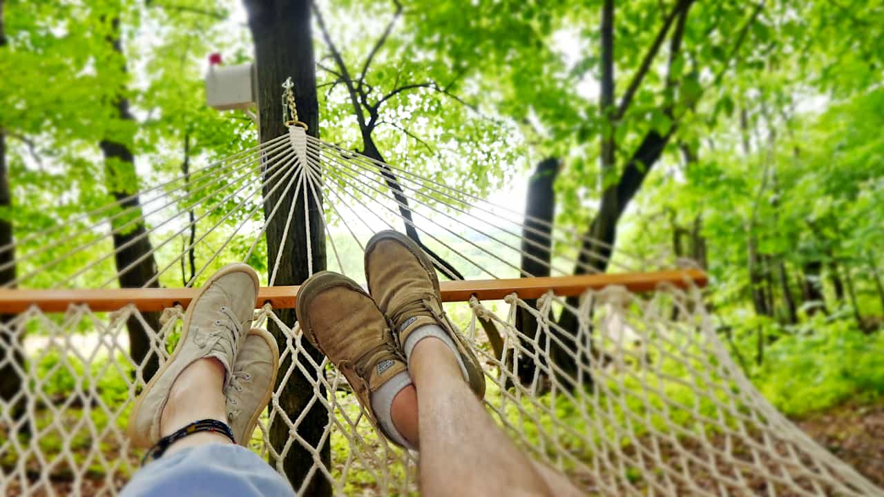 Hike up Canvas Cottages Glampsites' easy forest trails to discover the enchantment within. Between a stand of old oak, a hammock for two awaits.