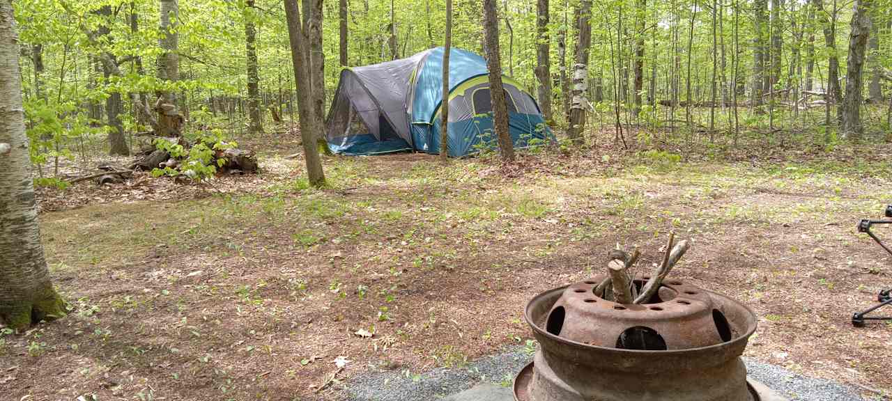 10 person  tent fire pit  cooking  area canopy  tent outside  toilet  and  shower extra spots  for personal  tents