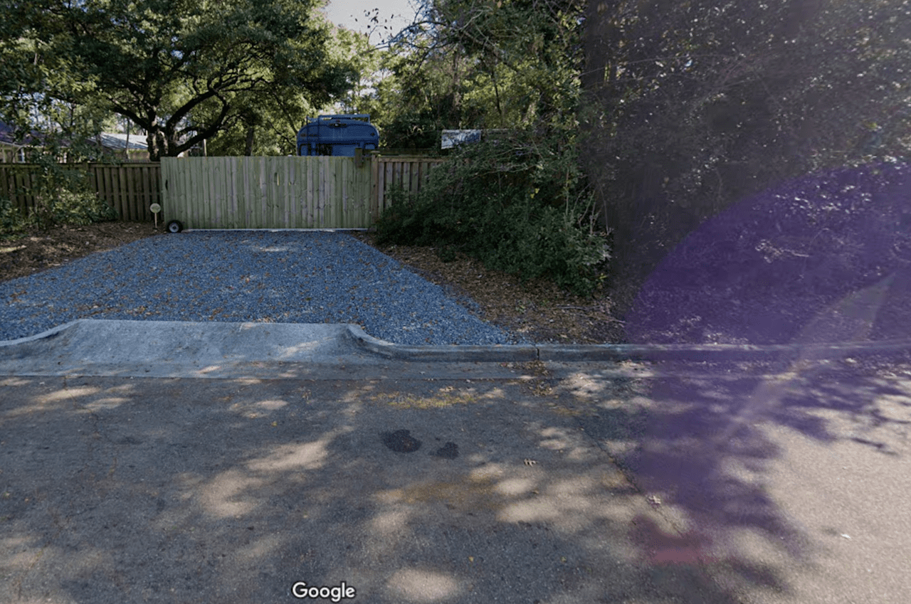 Entrance gate as seen from Oriole Drive . Lock code is 4926