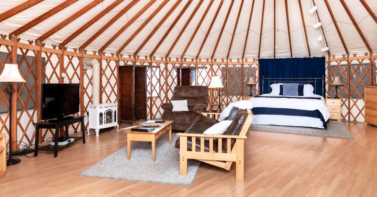 All of our yurts have a similar set up with a few differences. This is the living room of one of our Vista Yurts.