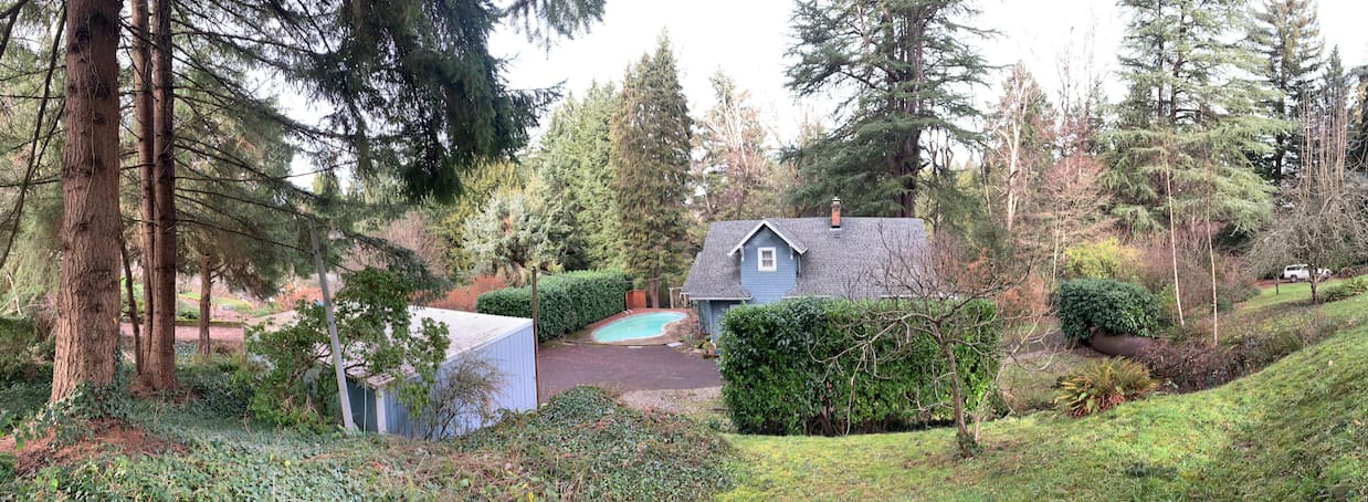 full one acre property photo. The black trailer is in the far left corner tucked behind the wall of hedges by the pool. You are free to use the pool!