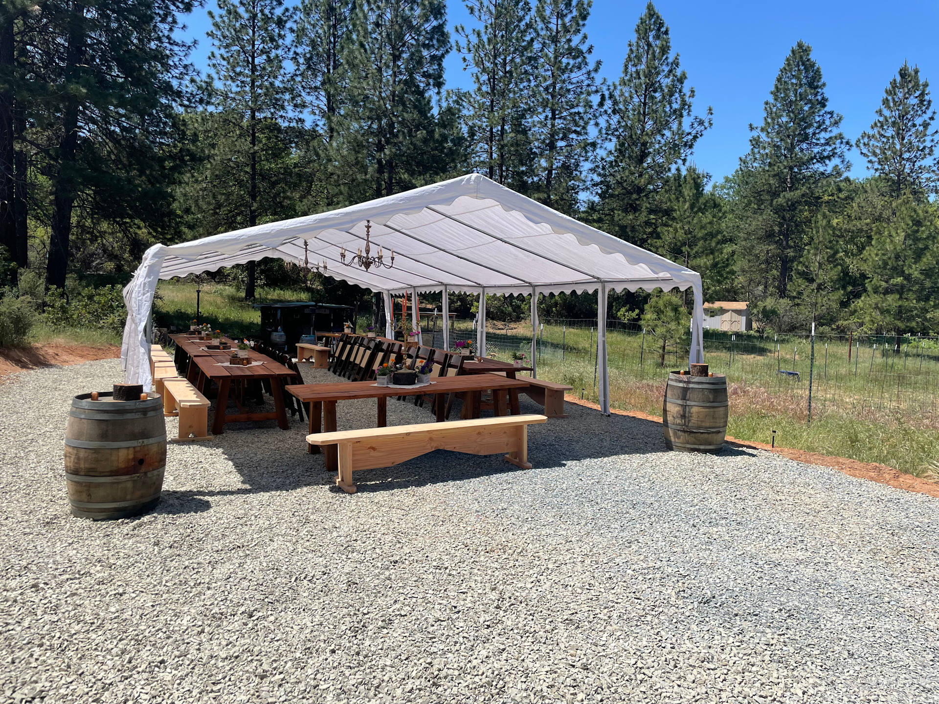 This is the same space as the other picture with the flat grassy area…we got the area graded and graveled and had our wedding tent set up there recently!  Crazy before and after!