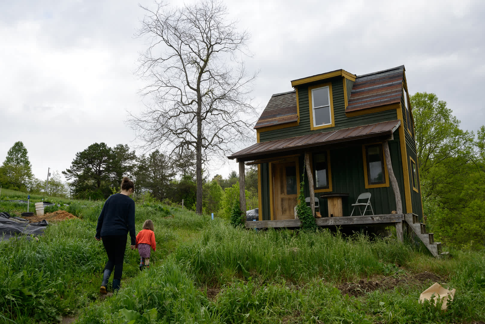The cabin sits atop a hill.