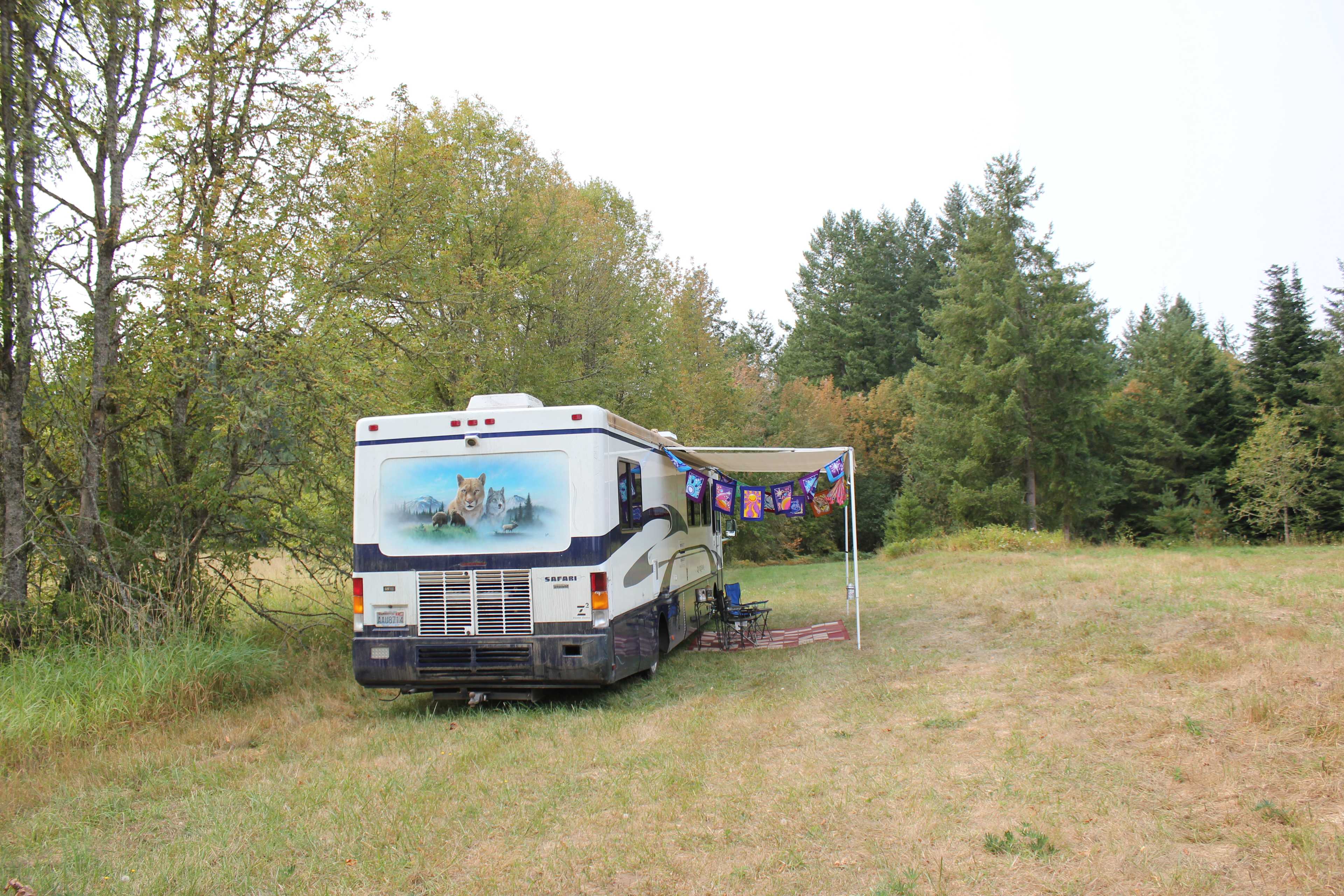 The Zanzibar Safari set in the edge of Auriel's arbor.  We have the awning out to provide an outdoor living area.  Tucked against the Zanzibar it provides protection from the winds yet gives one an expansive view.