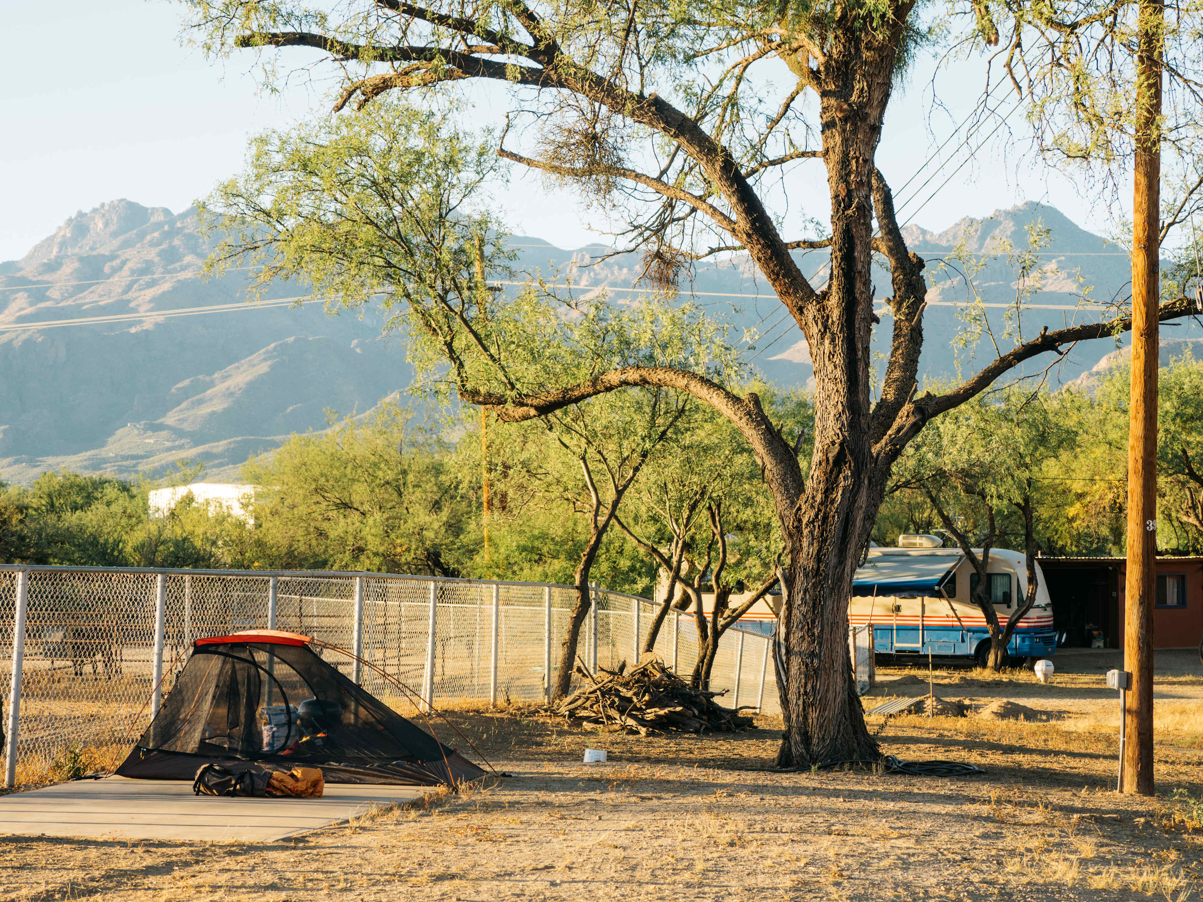 One site in the foreground, with another larger site back where the RV is parked
