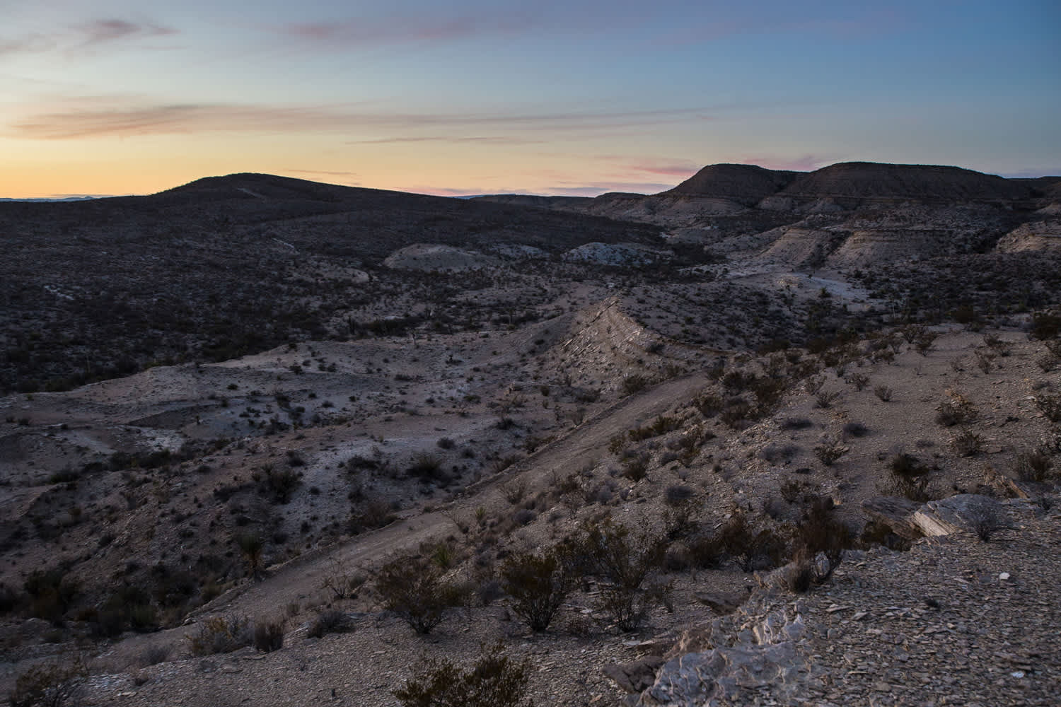 Sunset over the rolling hills and mountains.