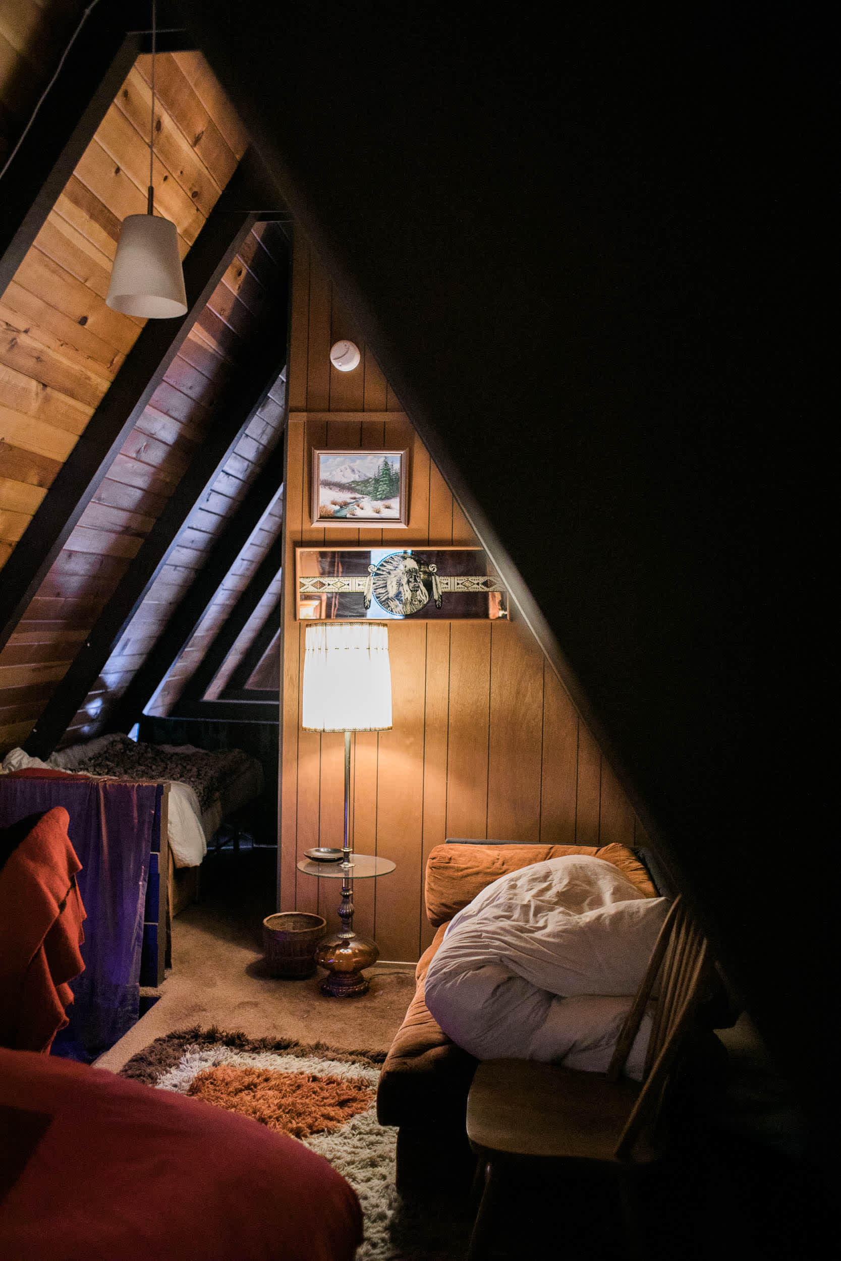 upstairs has a queen bed, twin bed, and couch