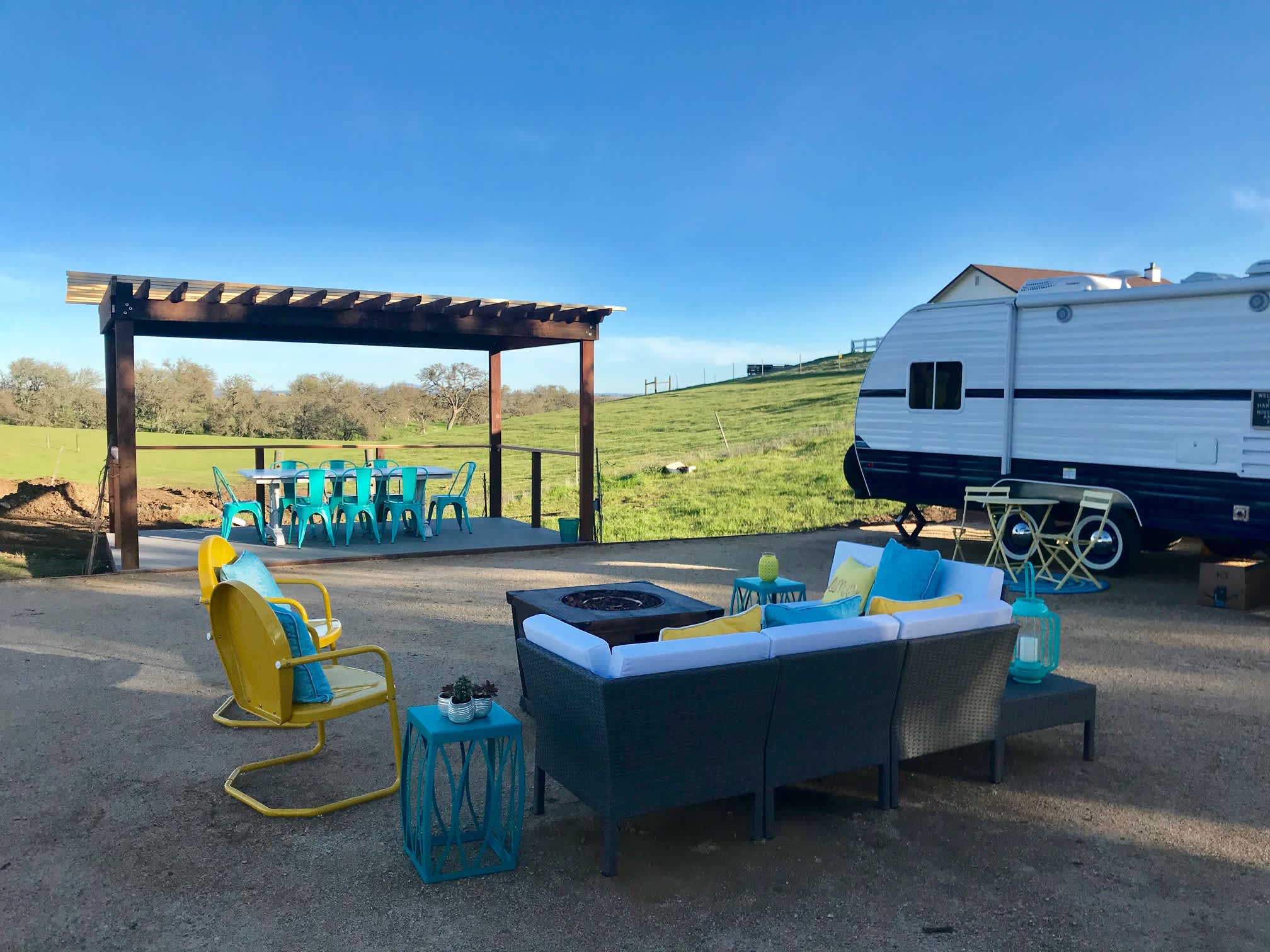Community outdoor space with fire pit, and large community dining area.