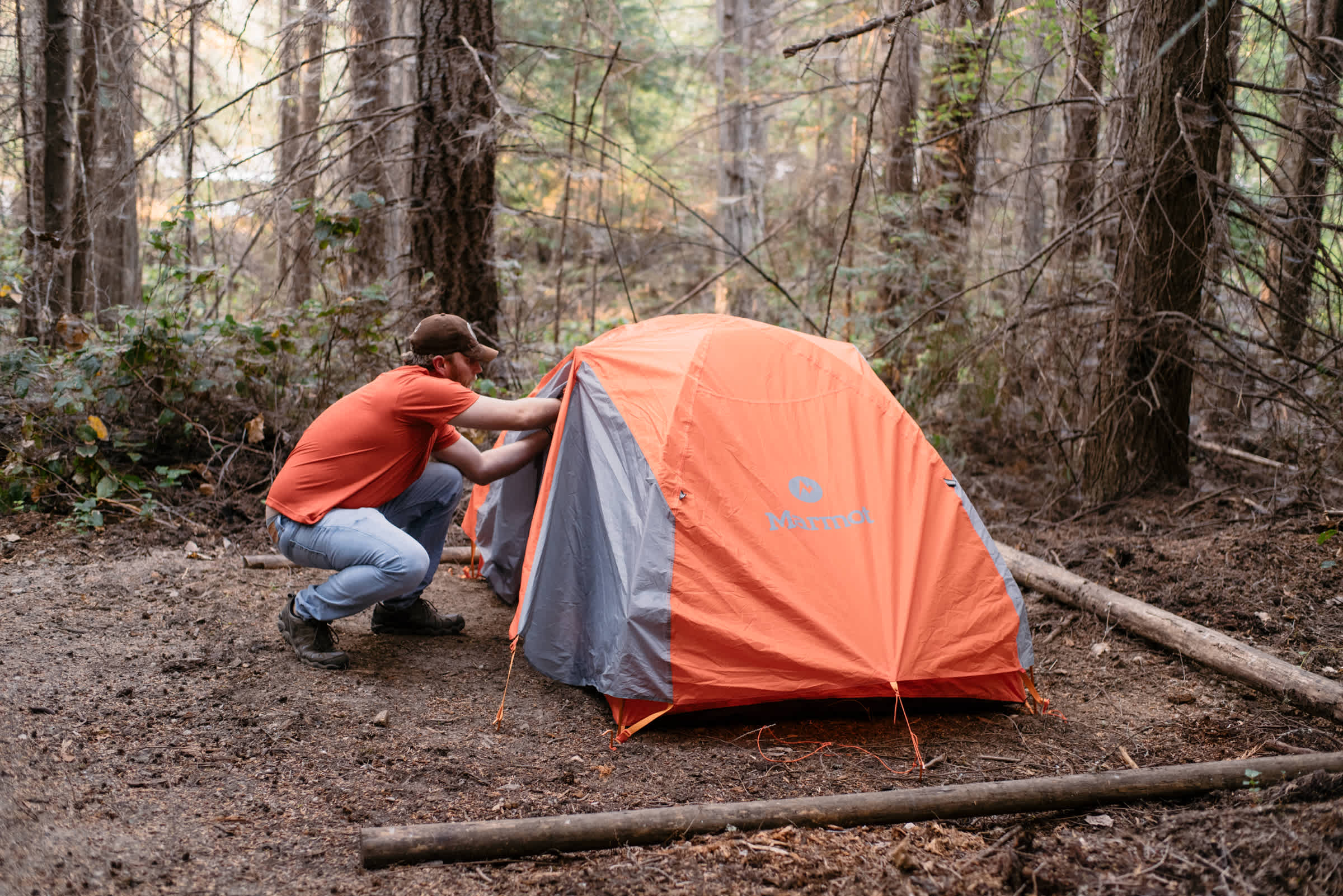 Size comparison. They have several sites to set up your tent in. This is a 2 person backpacking tent. Guy in red shirt is over 6' 3''.  Plenty of space all around. 