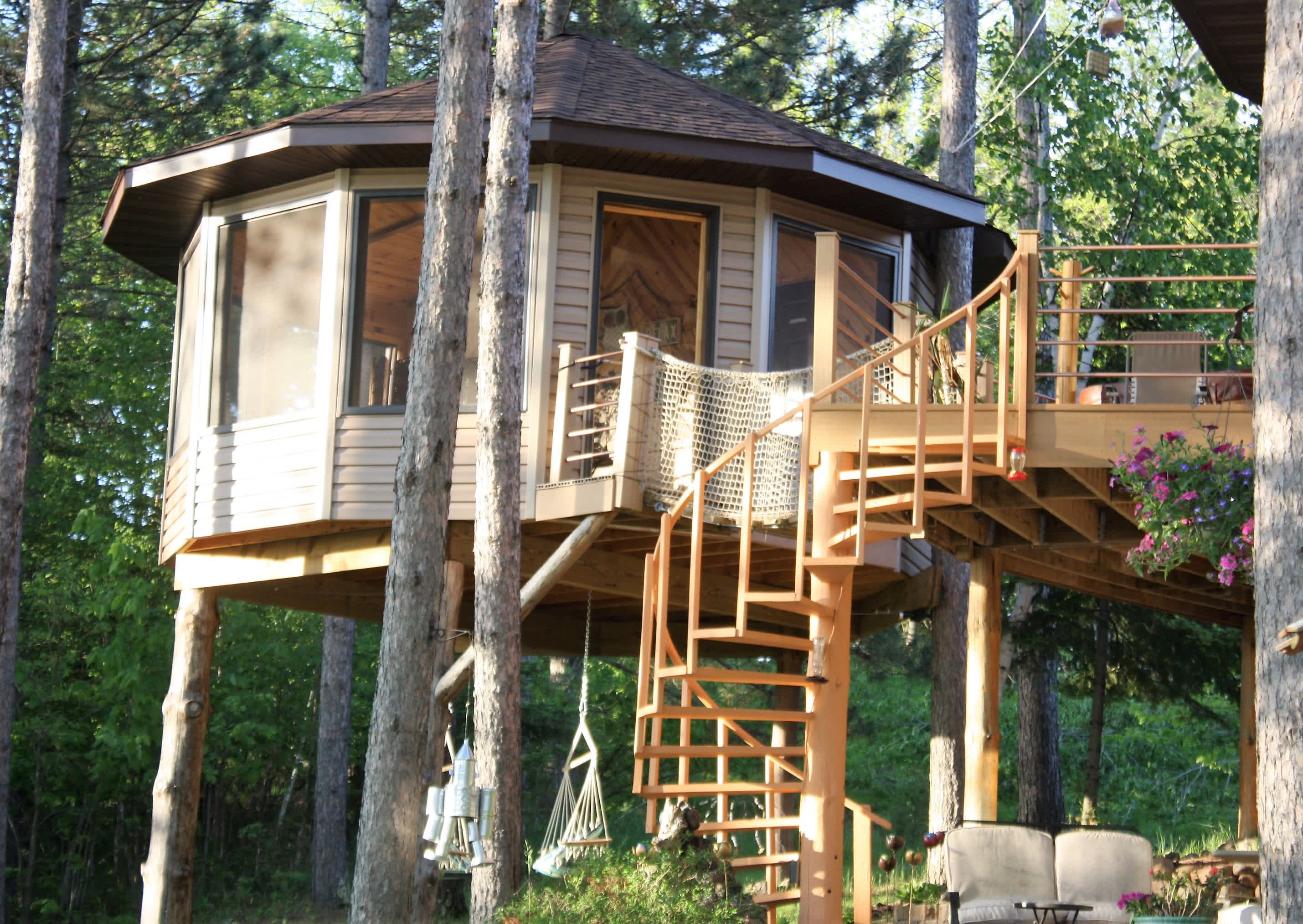 The tree house faces the lake next to our home where we live full time.