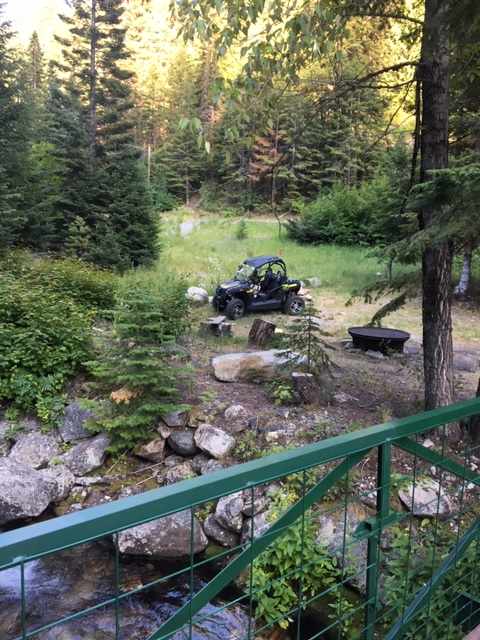 Fire pit right off a foot bridge