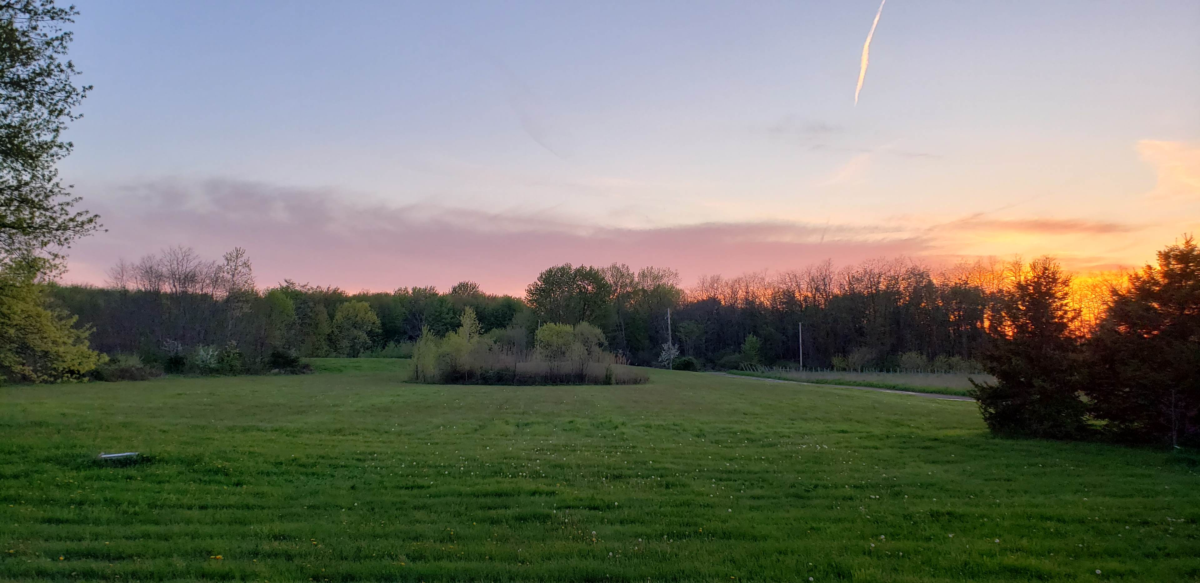 Sunset looking across the property and towards the pond.