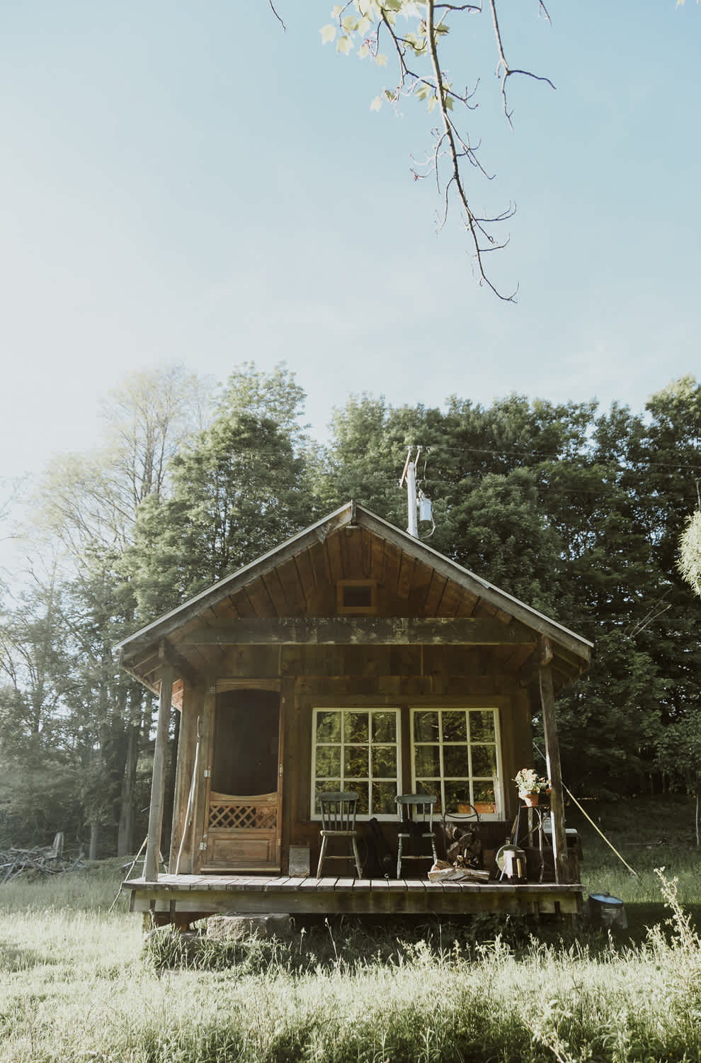 View of the lovely cabin while setting up for a campfire.