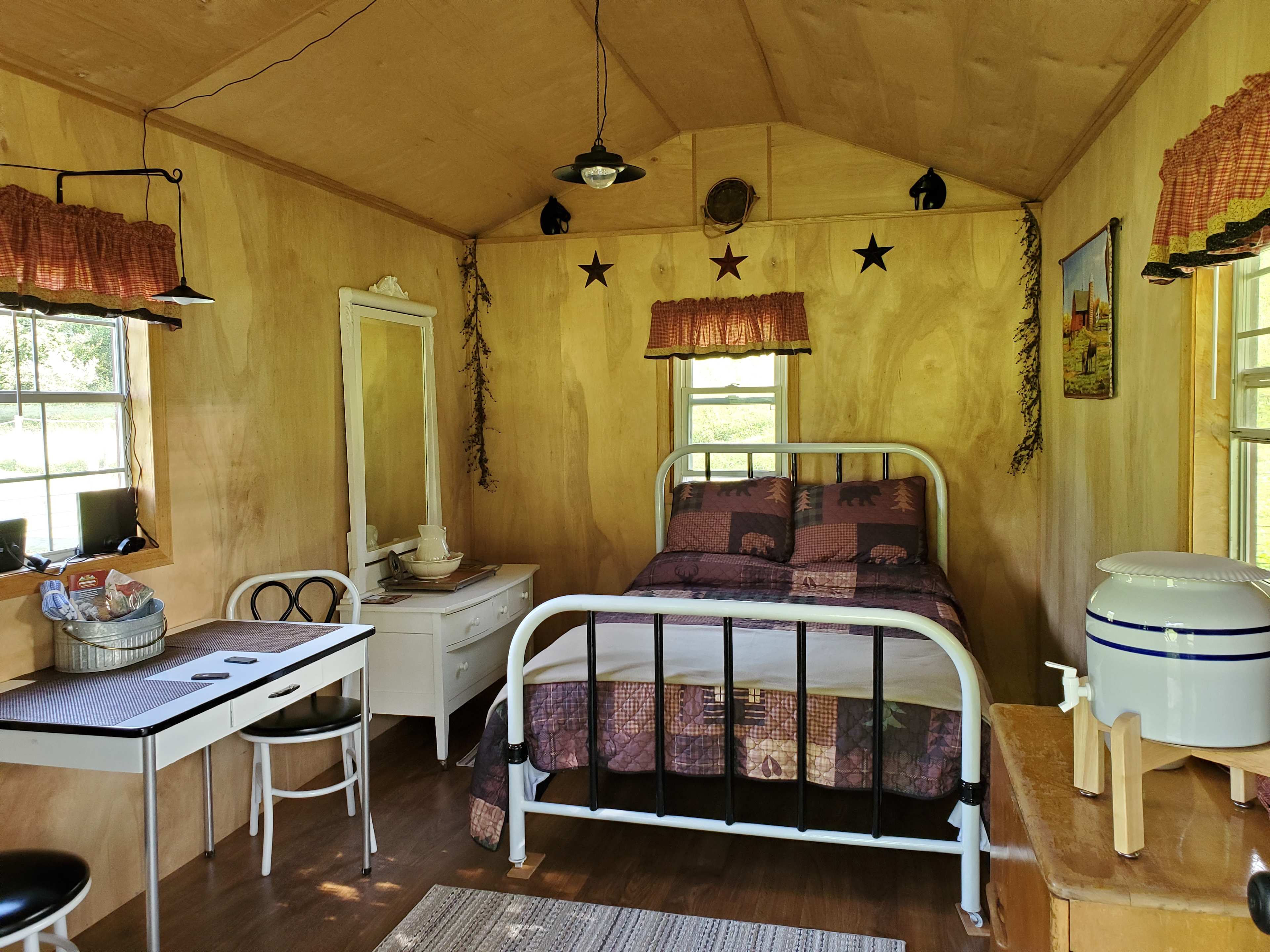 Inside view of Bed, dresser and table