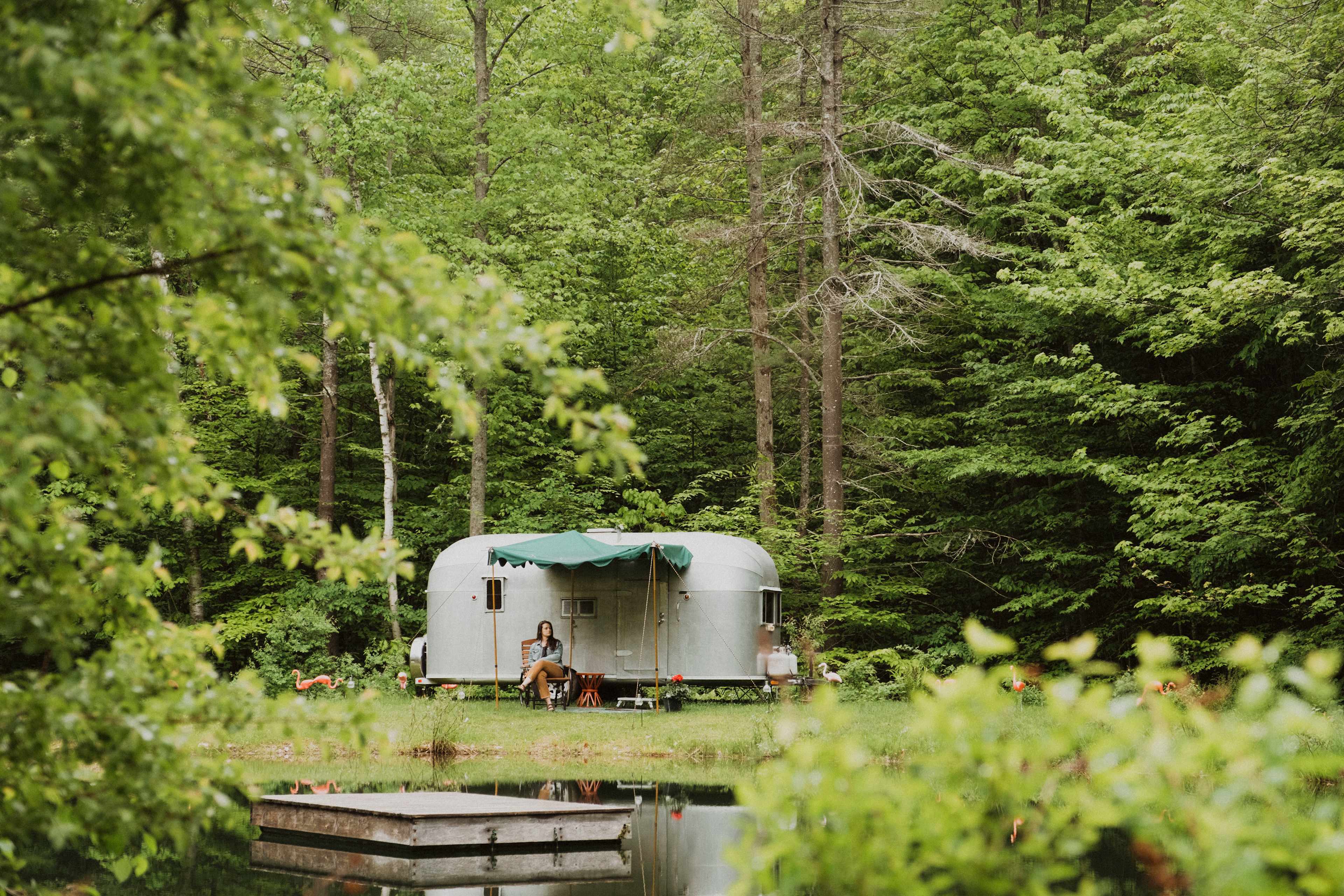 Swimming dock and camper tucked in the woods. 