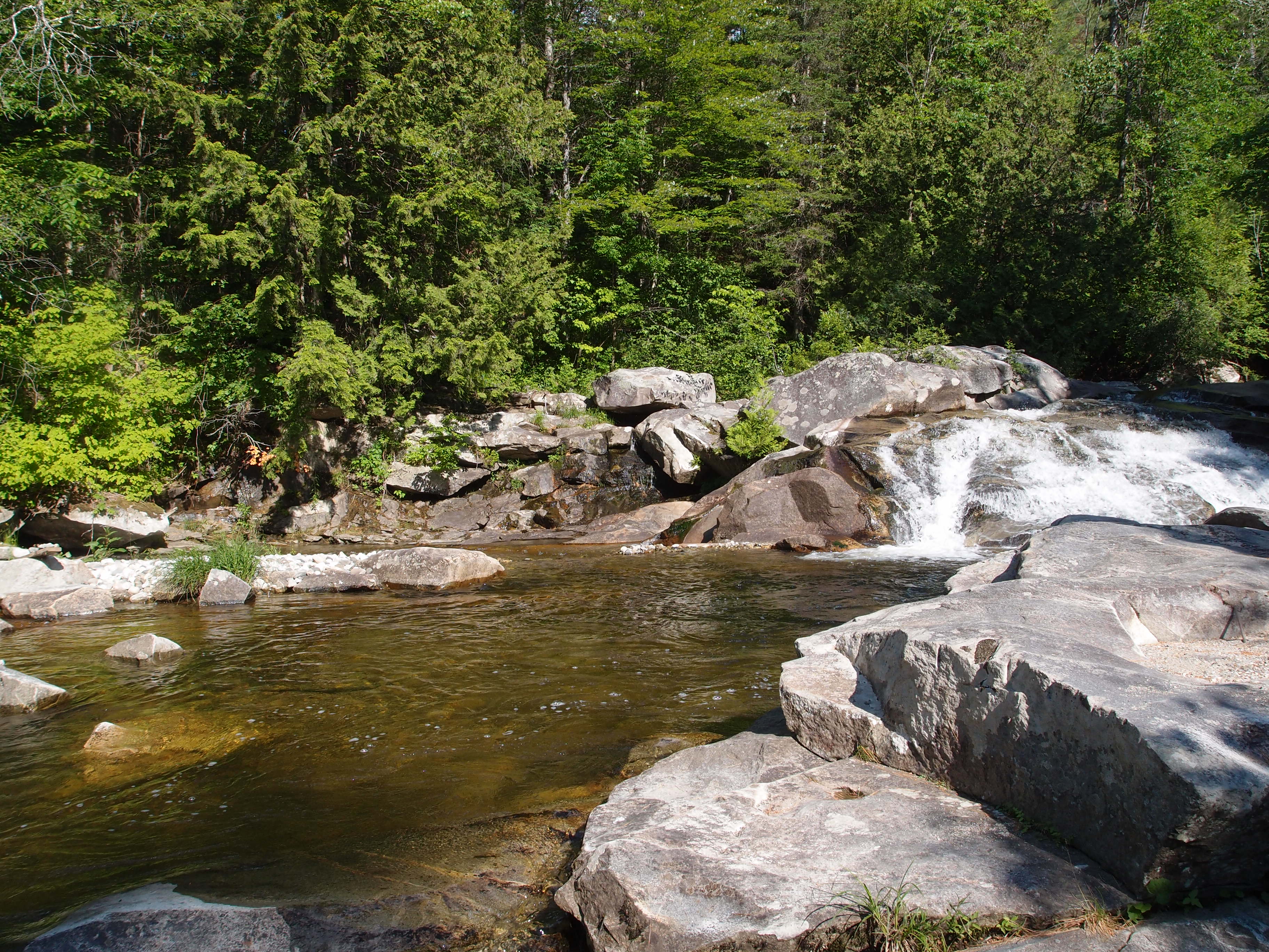 The main swimming hole and waterfall across from my property.  Waterfall is to the right of the picture, I'm having trouble to the update.