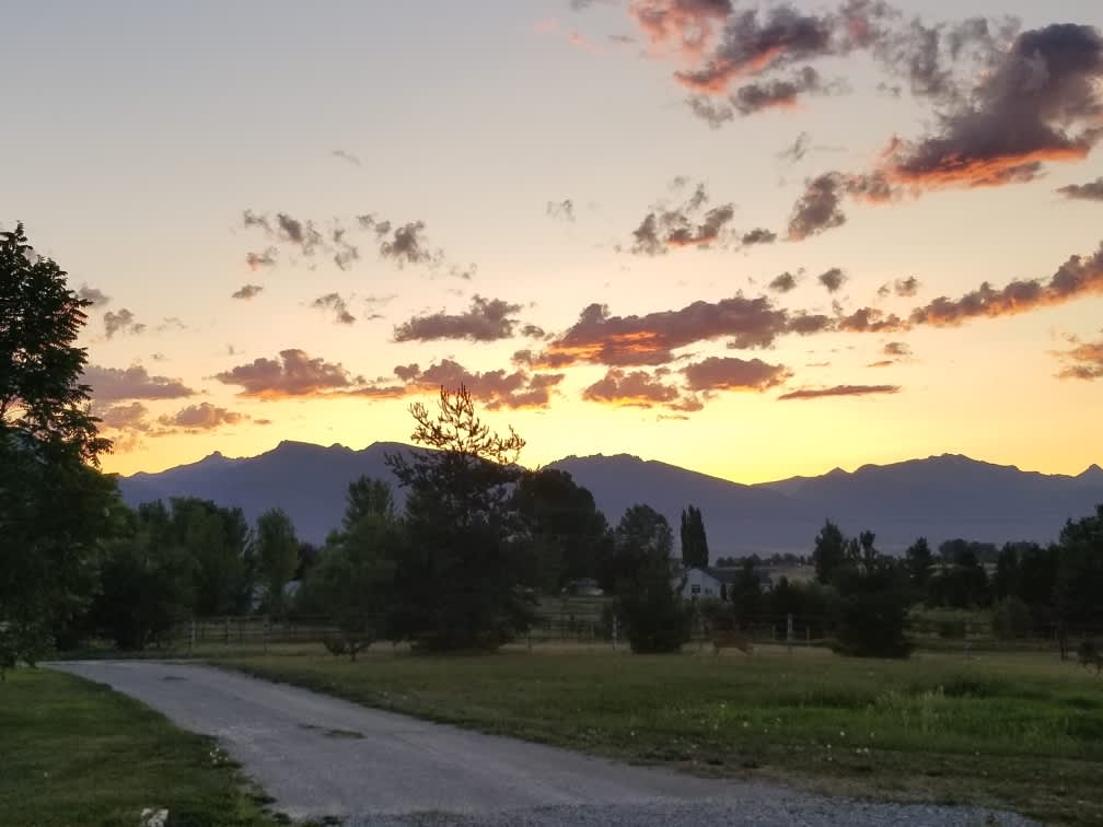 Shown at sunset, this is the driveway you will turn onto as you arrive at the ranch.