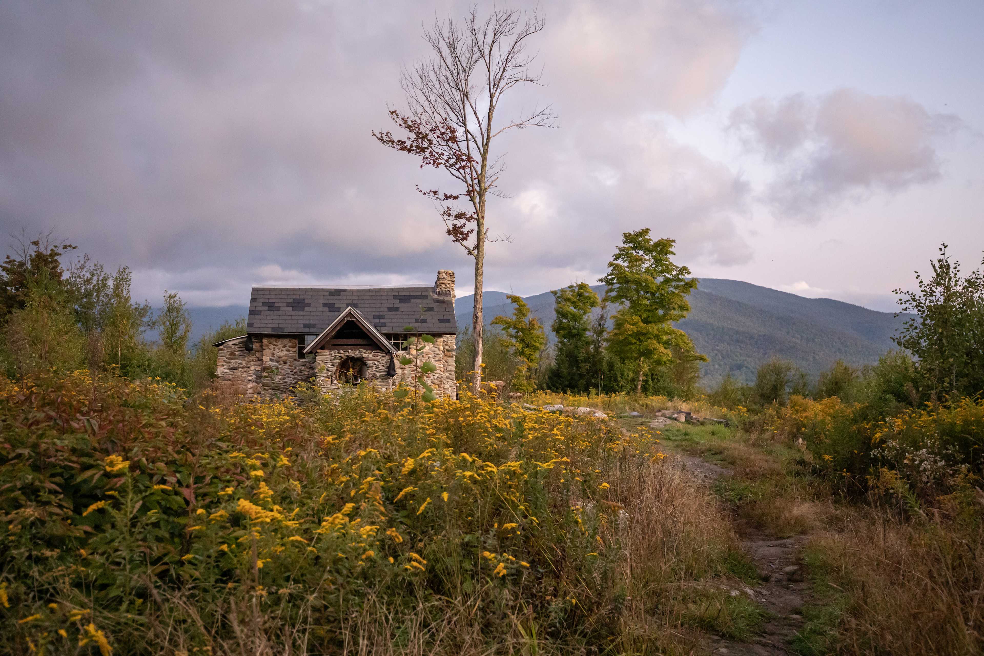 looking back at the cabin from the outhouse trail during sunrise