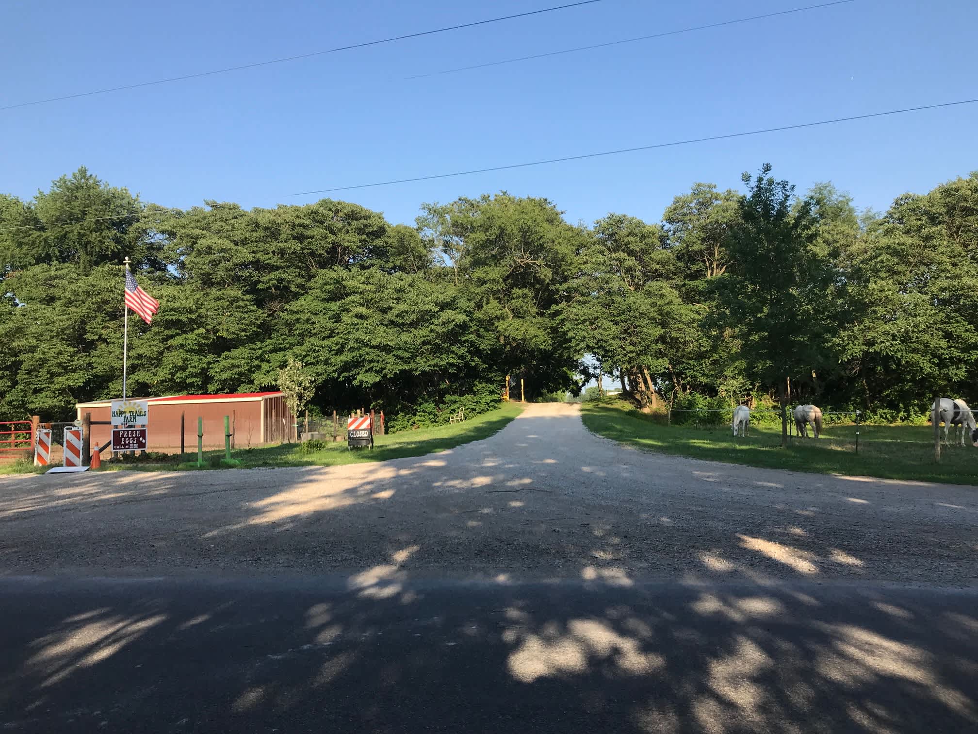 Front Entrance Road view, and graveled parking at pony pen.