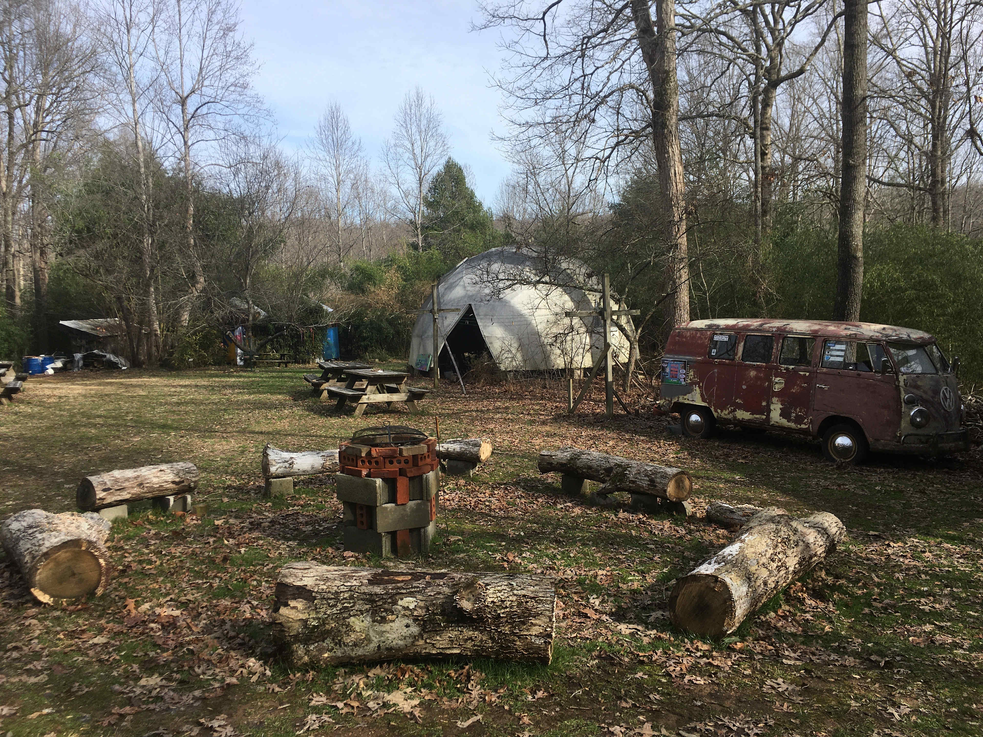Our common area includes a grill/fire pit surrounded by oak logs. campers may also tour our permaculture gardens and visit our gift shop.