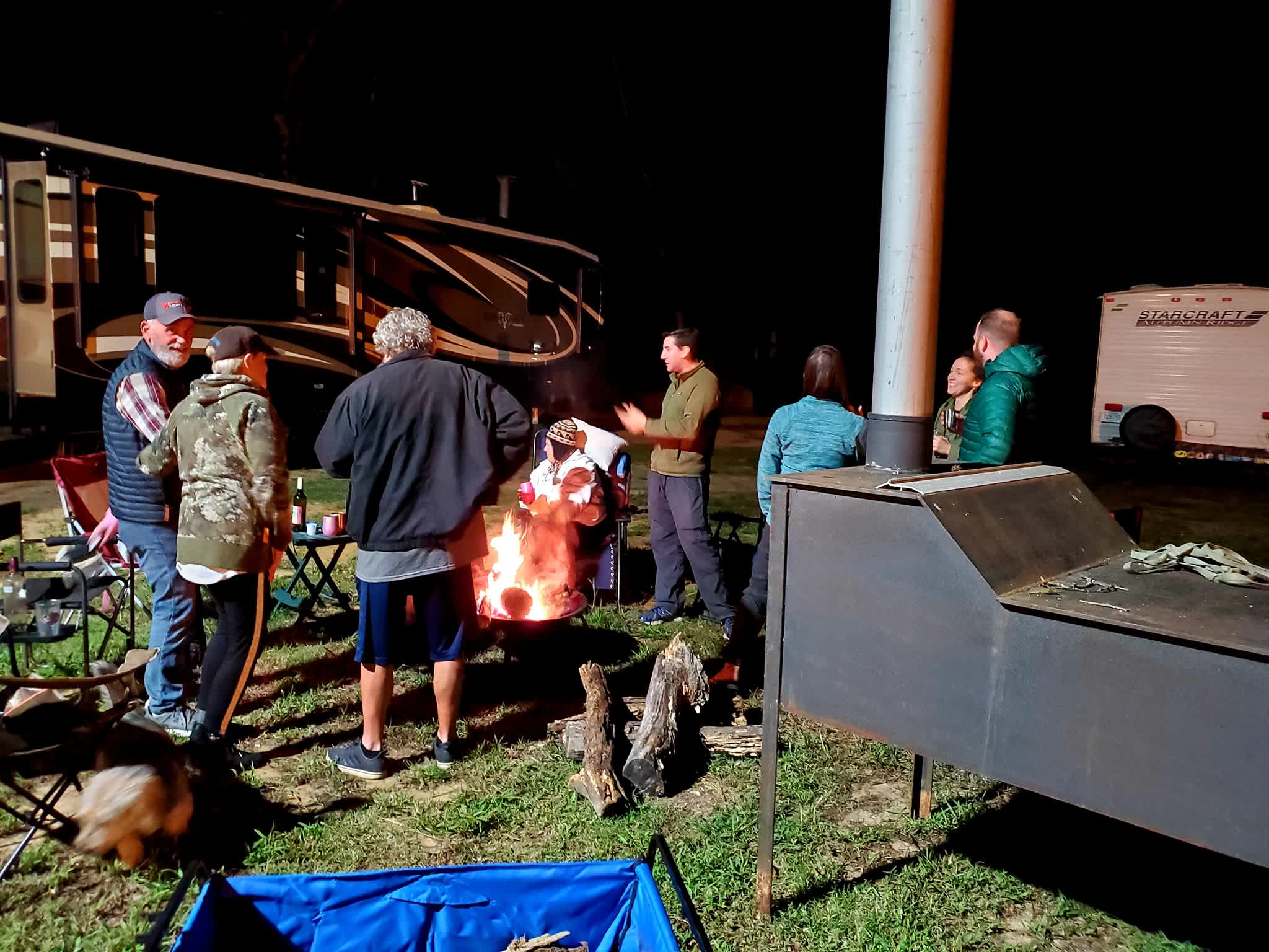 Campers enjoying our fire pit on a cold evening.
