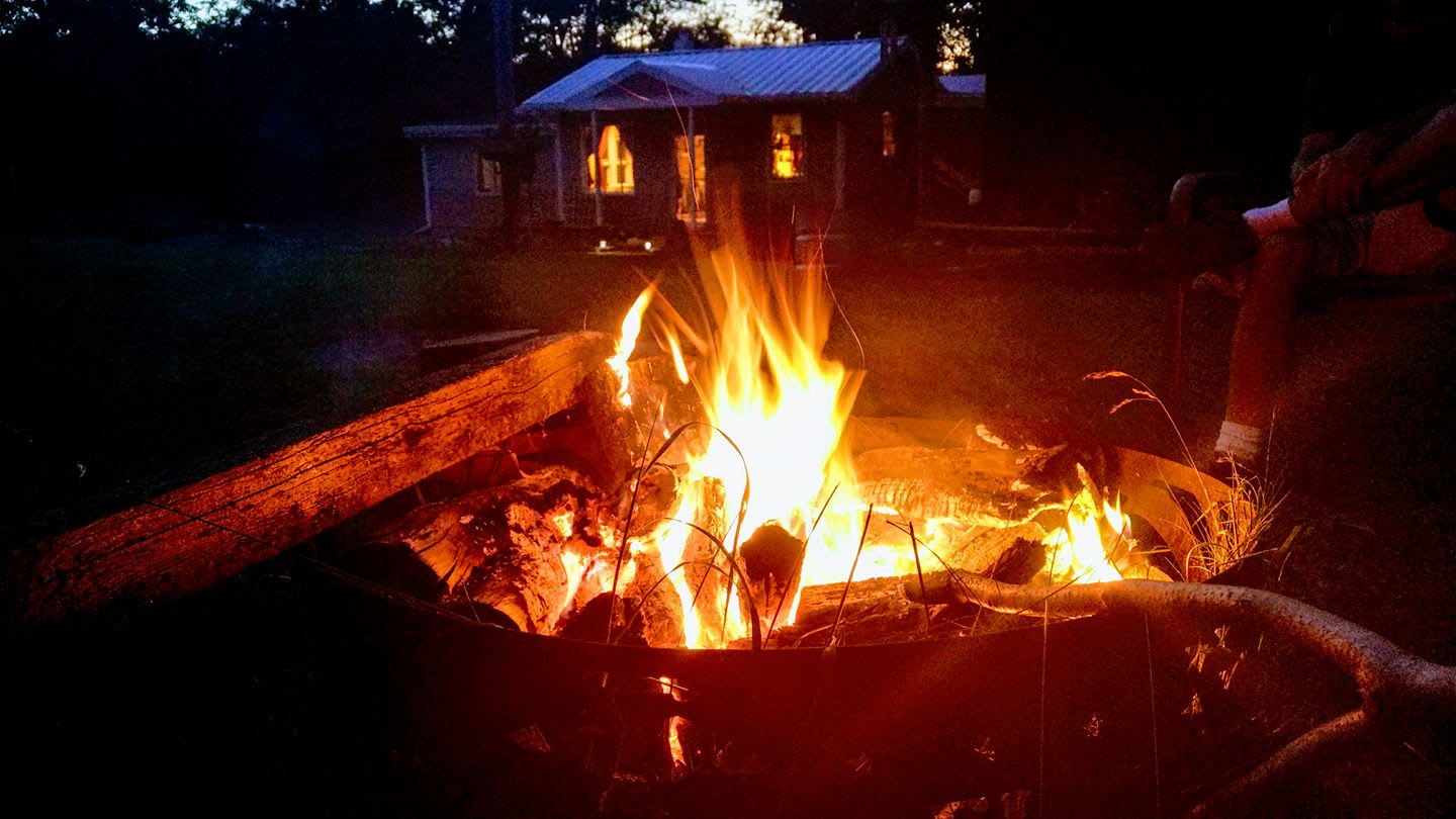 Fire ring near the tiny house and looking toward our main house.
