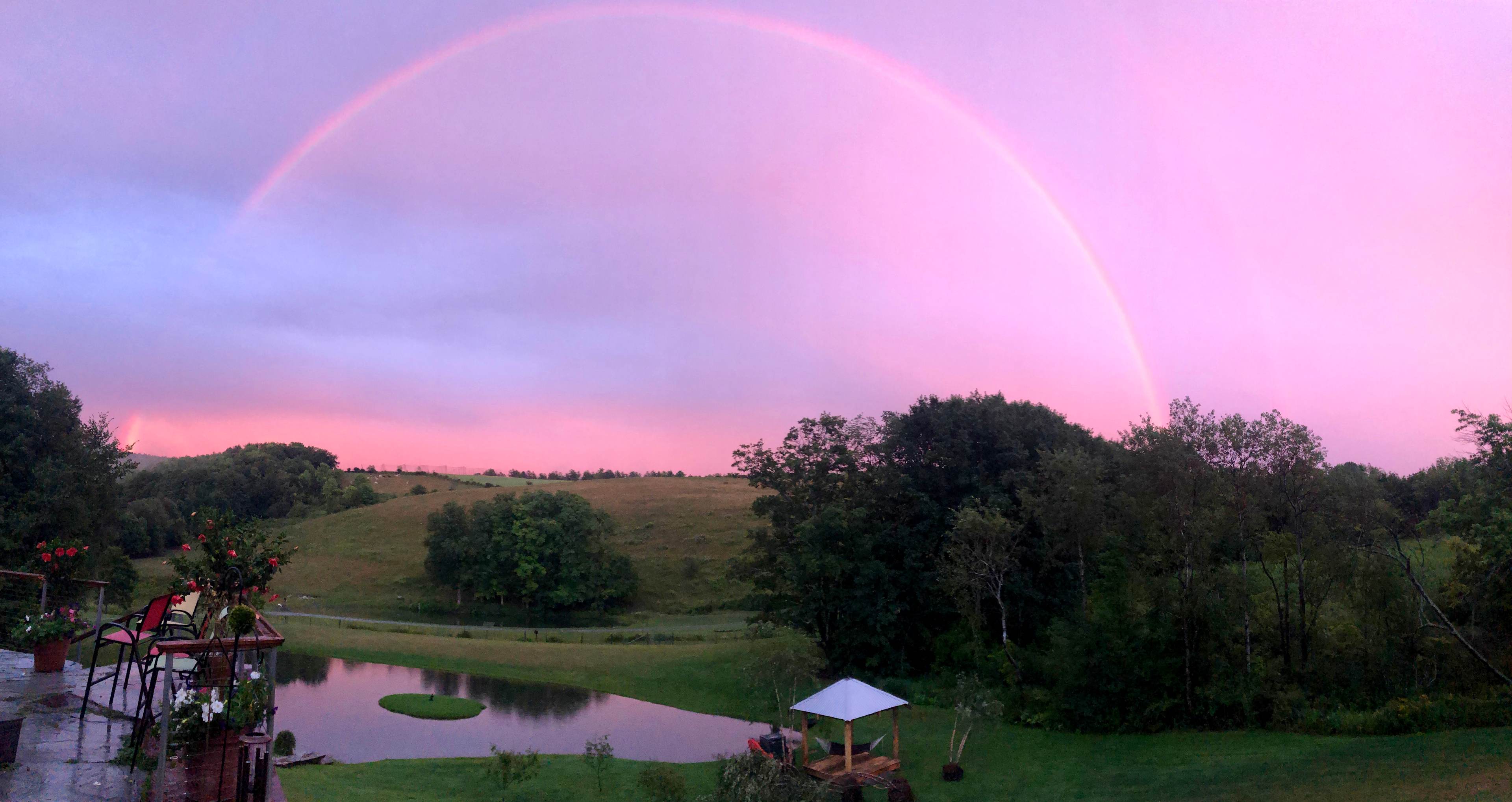 View from the Outhouse, Gardens, Hopsyard, Hiking Trails & Wooded Camp Sites are in the hills beyond.