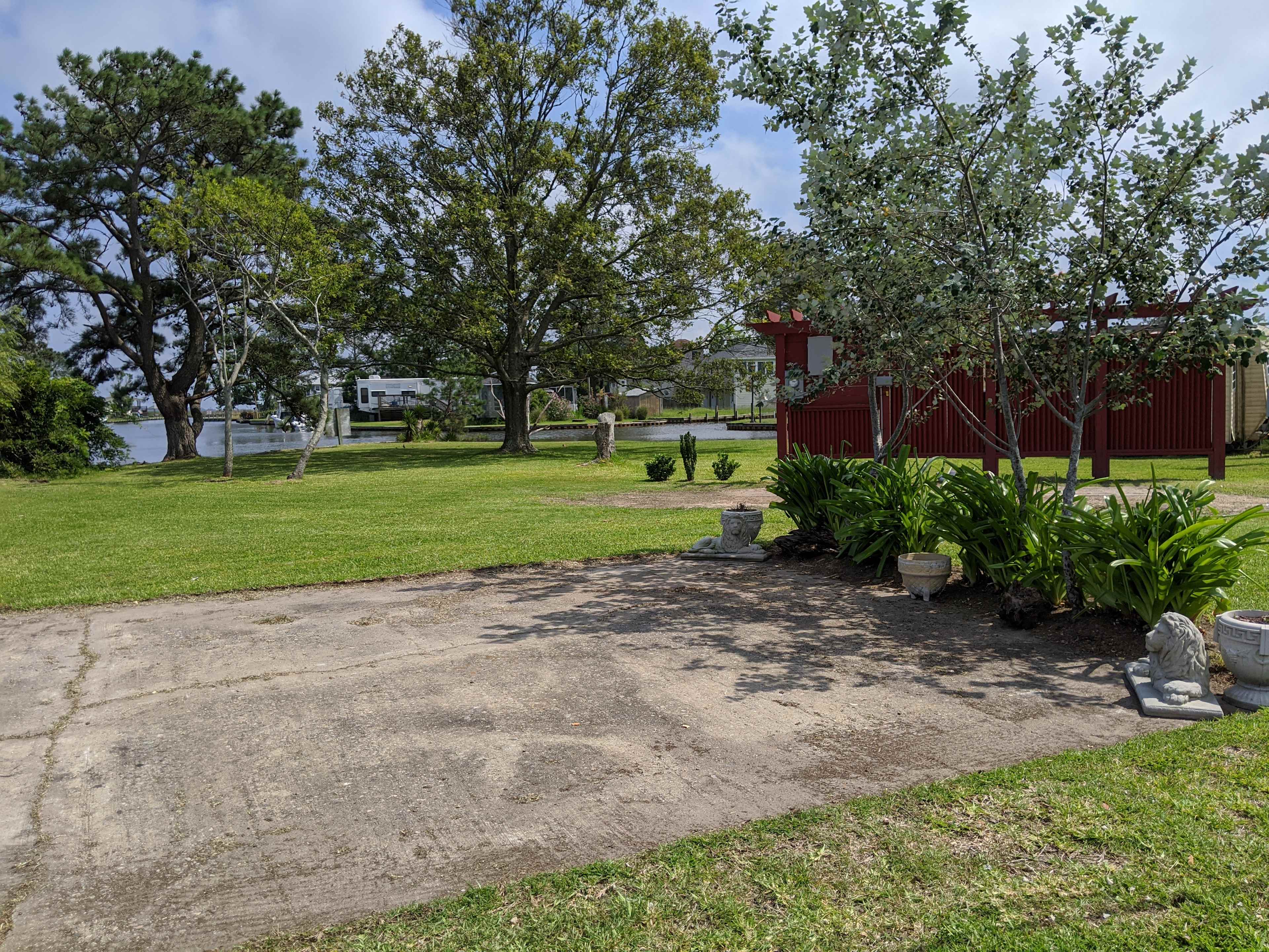Concrete pad for dinning and relaxing. Table seats 6 and is available during rental and stored when vacant.