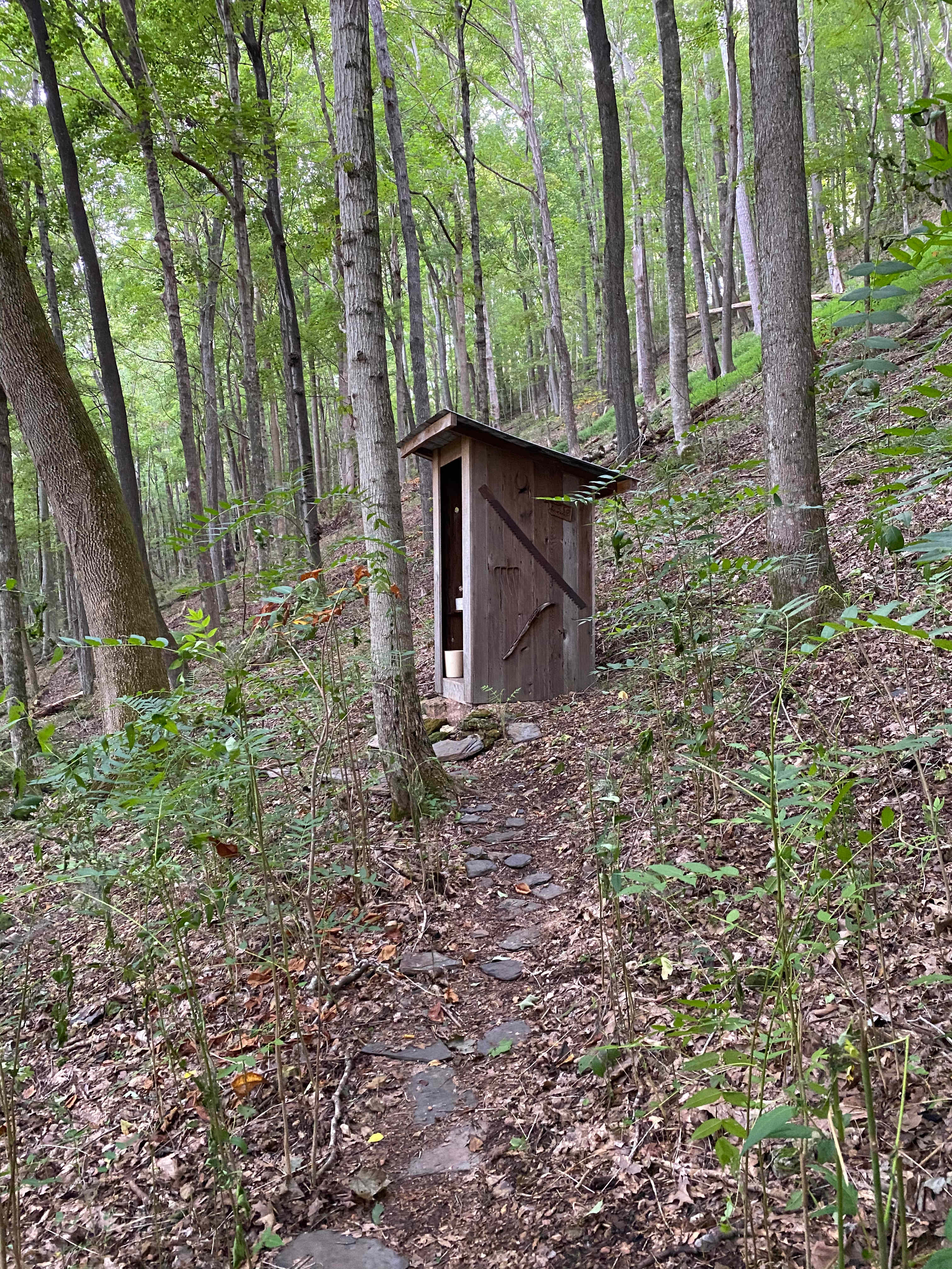 Clean and comfortable outhouse with a lovely view