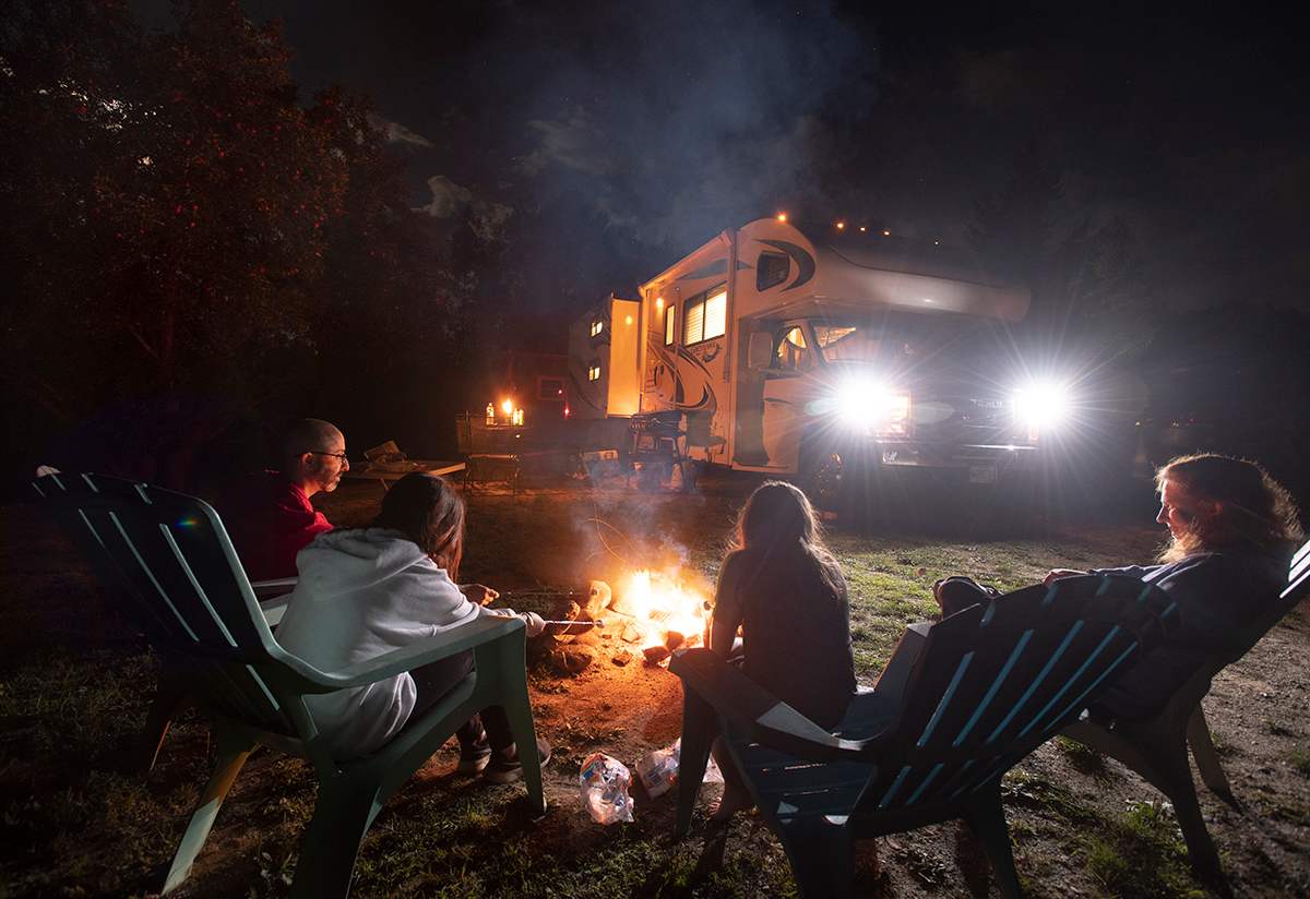  Daniel and his family make s'mores under a moon lite sky at Ellie's RV spot.