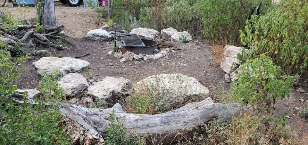 May the Forest Be With You has a shared fire ring with one other space, complete with a cooking grate and large rocks to sit on. Perfect for hot dogs, hamburgers, marshmallows, and more. Please practice fire safety rules and douse fire after use.