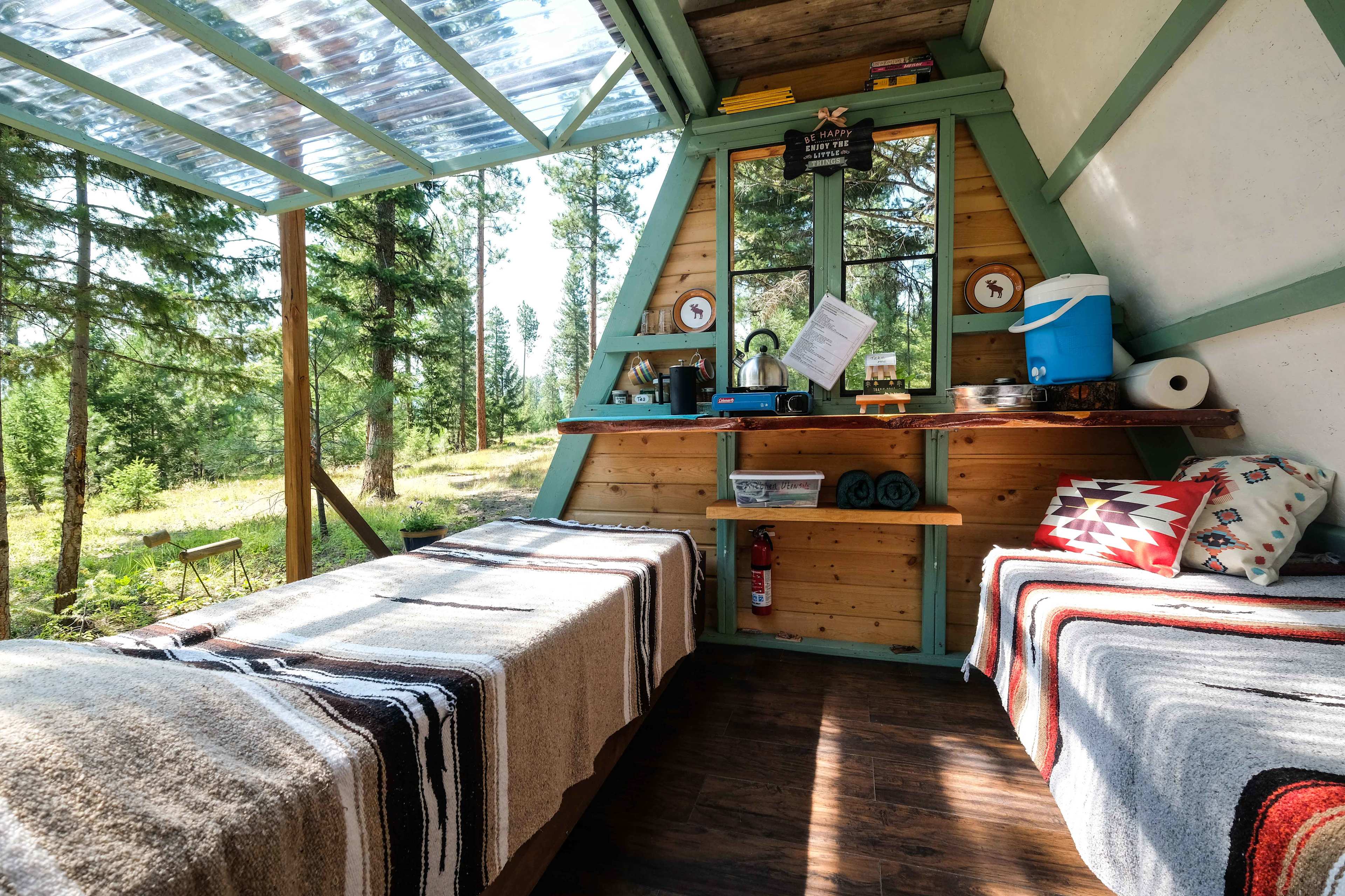 Your simple yet effective kitchen with a camping cooktop, water, coffee/tea fixings.  

You'll have full access to a well-stocked shared kitchen (fridge, small oven, BBQ, etc) in the commons area just a two-minute walk away.  