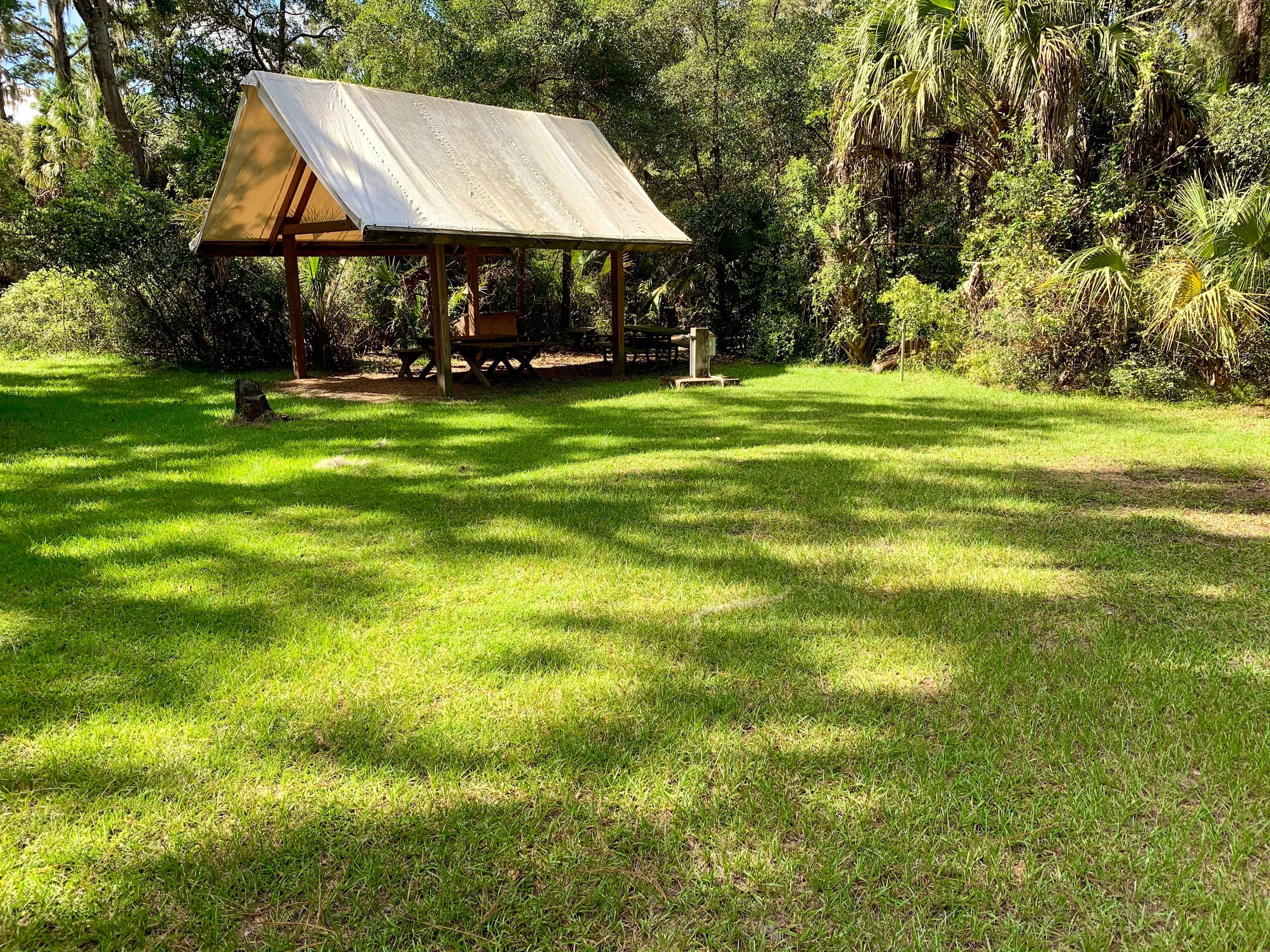 Tent Camping site #1. Electric/water, covered picnic area, and secluded fire pit. 