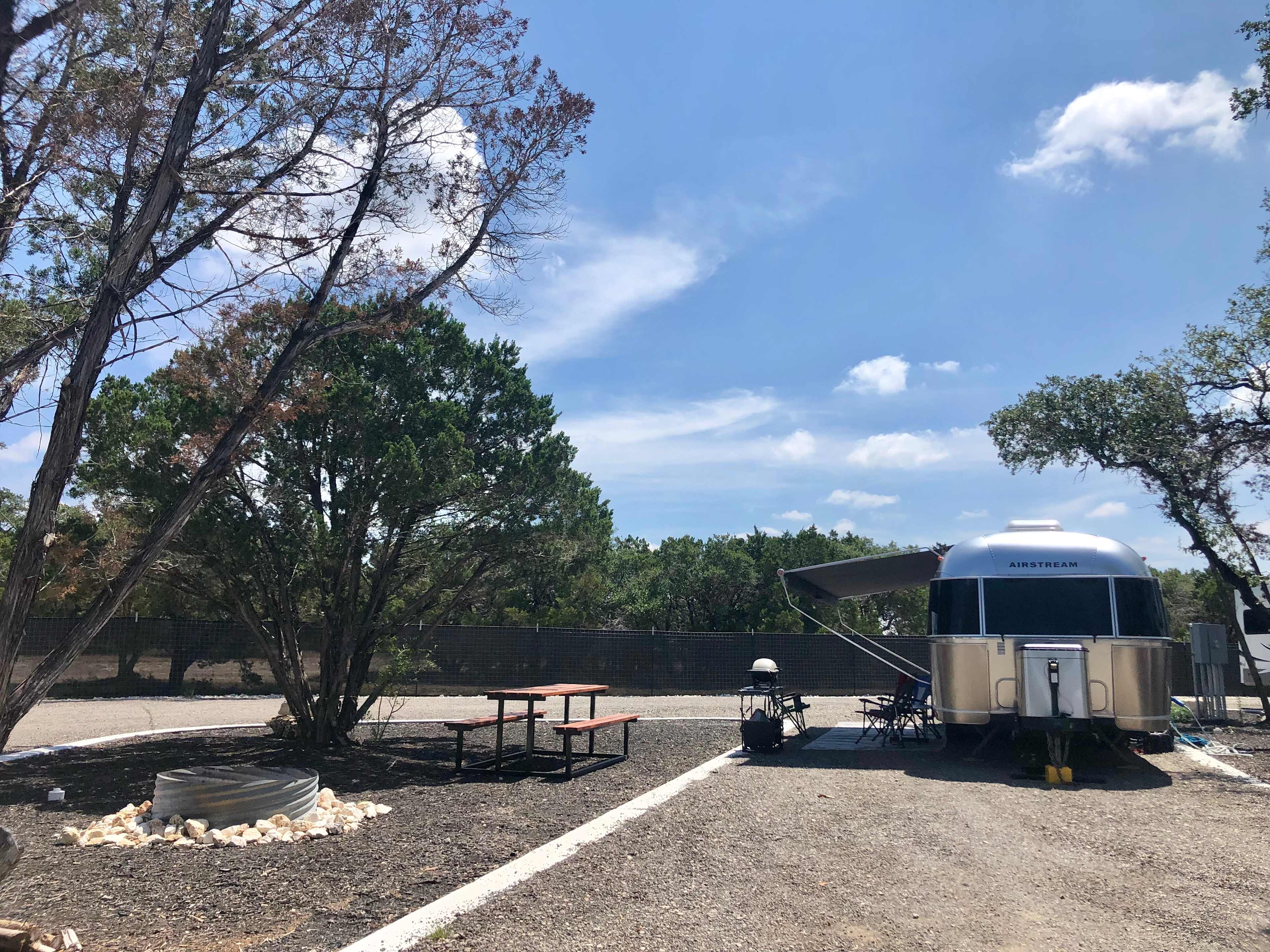 Sites 1 and 5 have their own natural areas with a fire pit and picnic table.