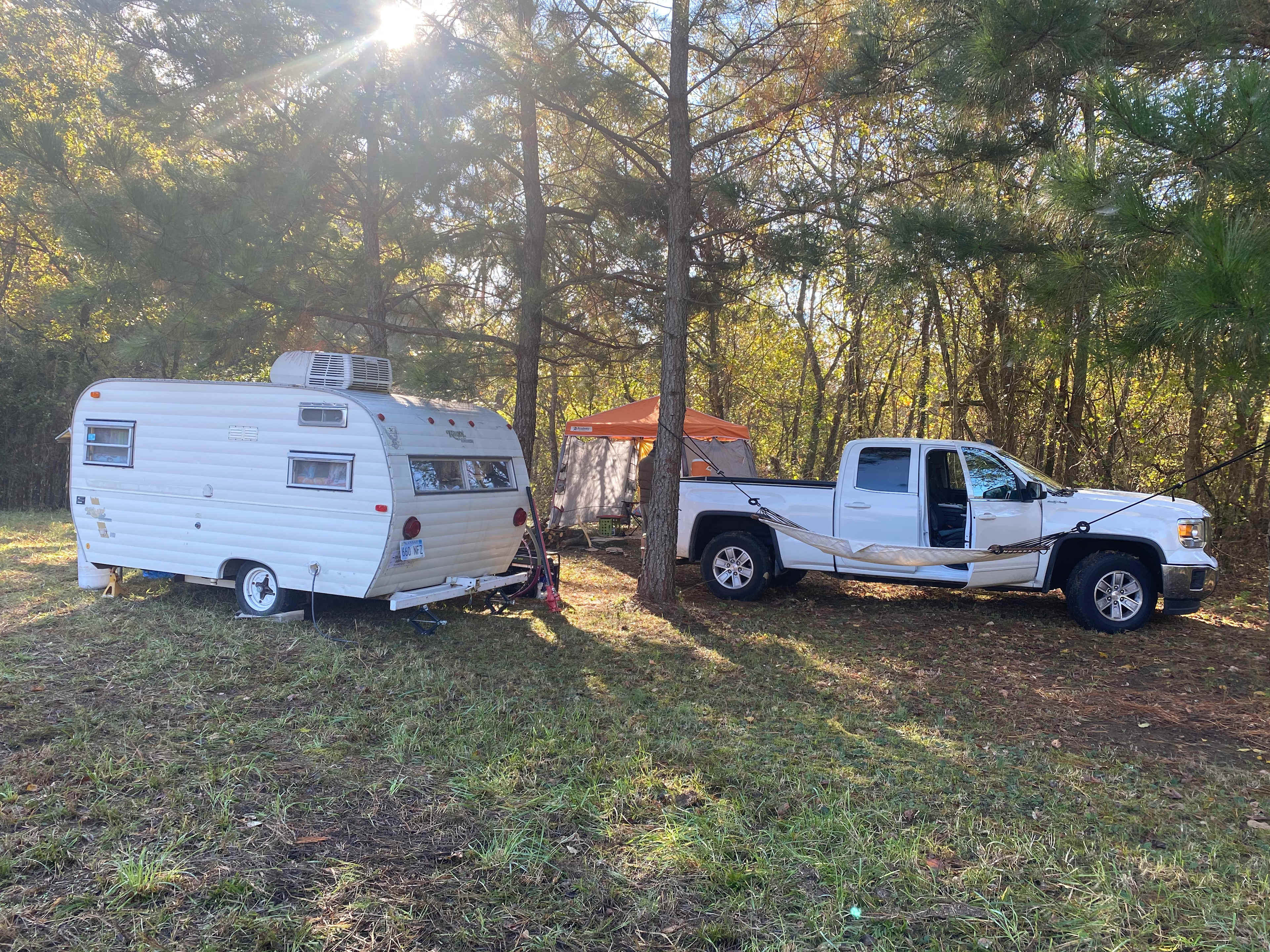 Camp spot next to stream close to river 