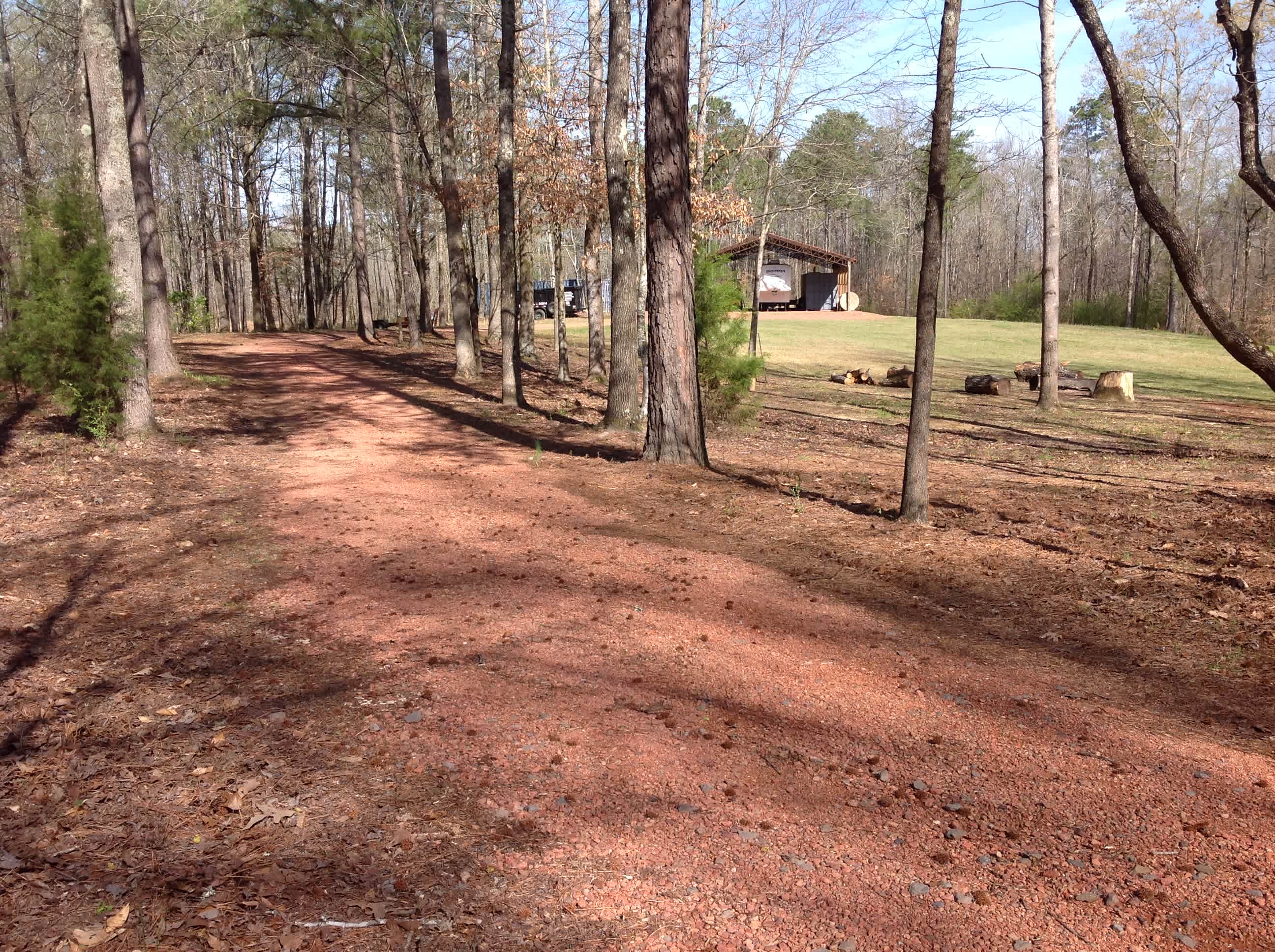 The red rock road entrance. Follow it around to the barn. 