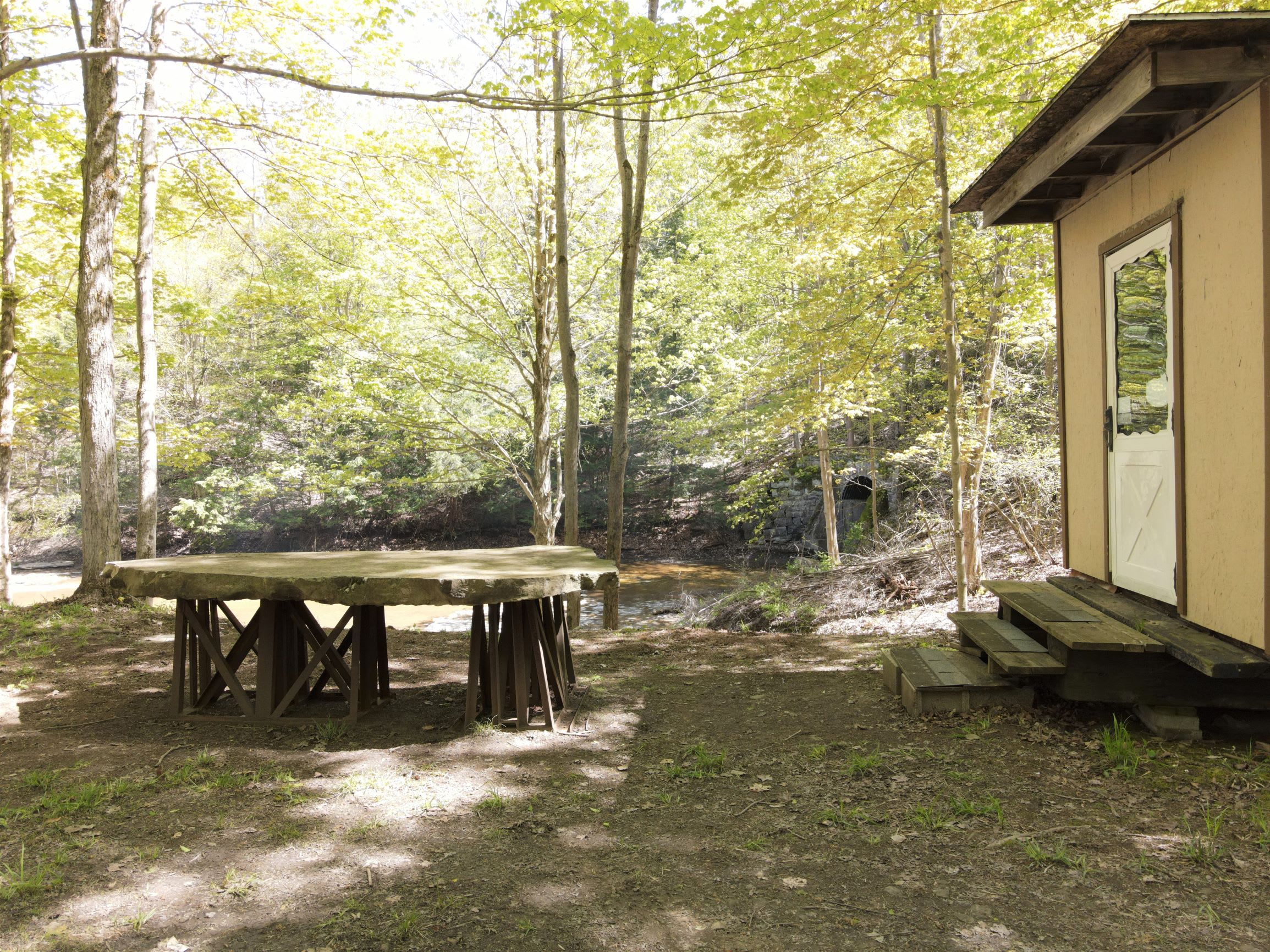 A storage building and a stone table