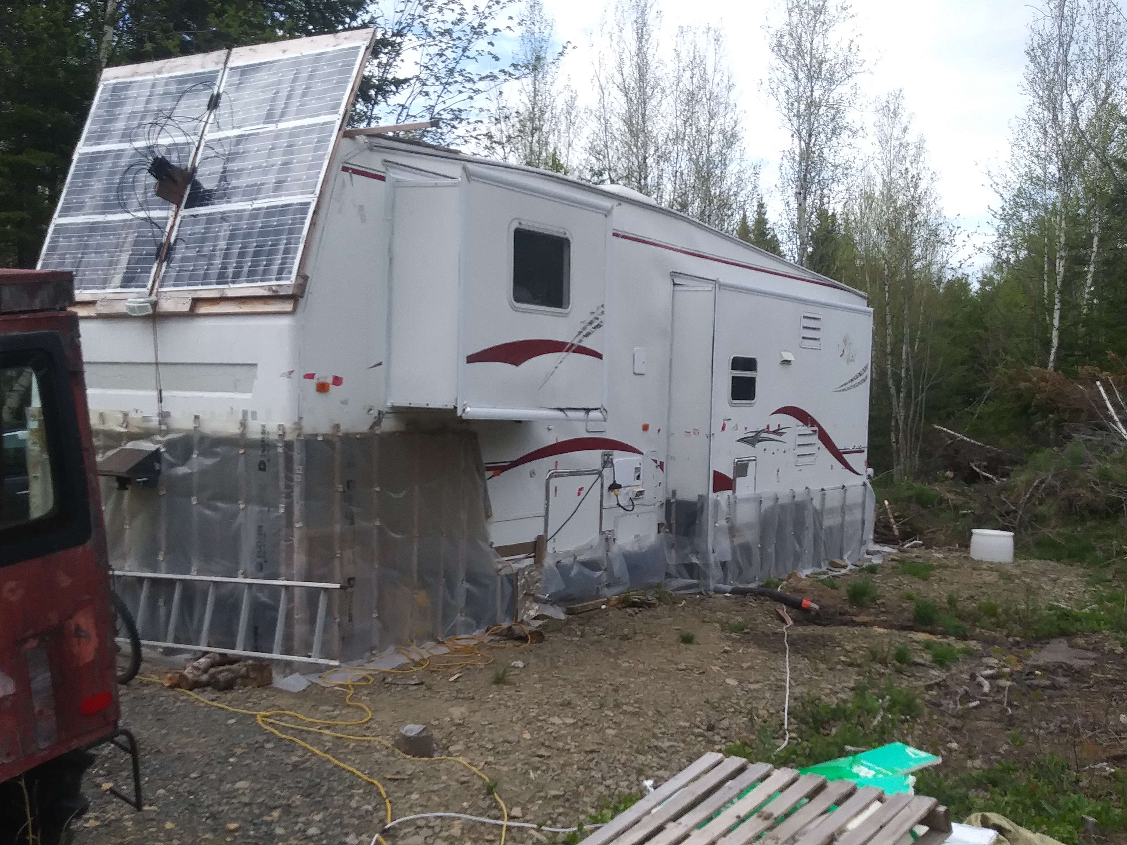 My 32.5' , 3 slide in the main yard solar and wind powered.