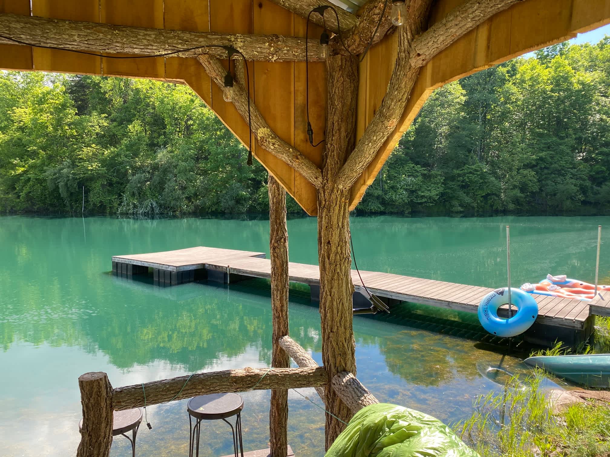 View of the pond and floating dock from the pavilion. The pond is clean and well stocked with fish.