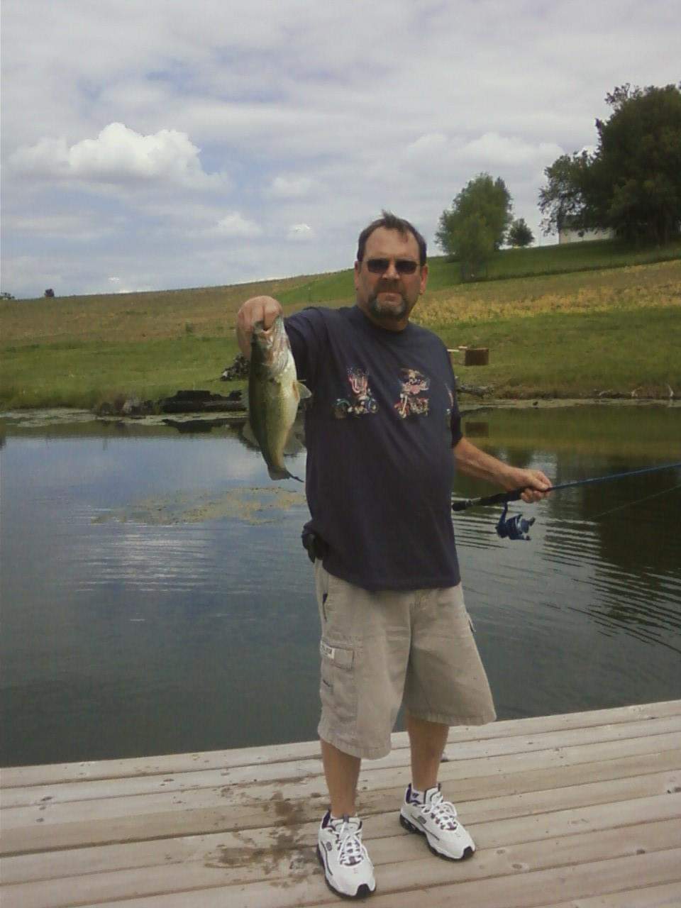 This is my husband, Vern, with a fish he caught a few years ago.  He threw this one back, and we have stocked even more fish, so there are some big ones to be caught. Please throw back the albino and small fish. We also have some fish food if you just want to feed them.