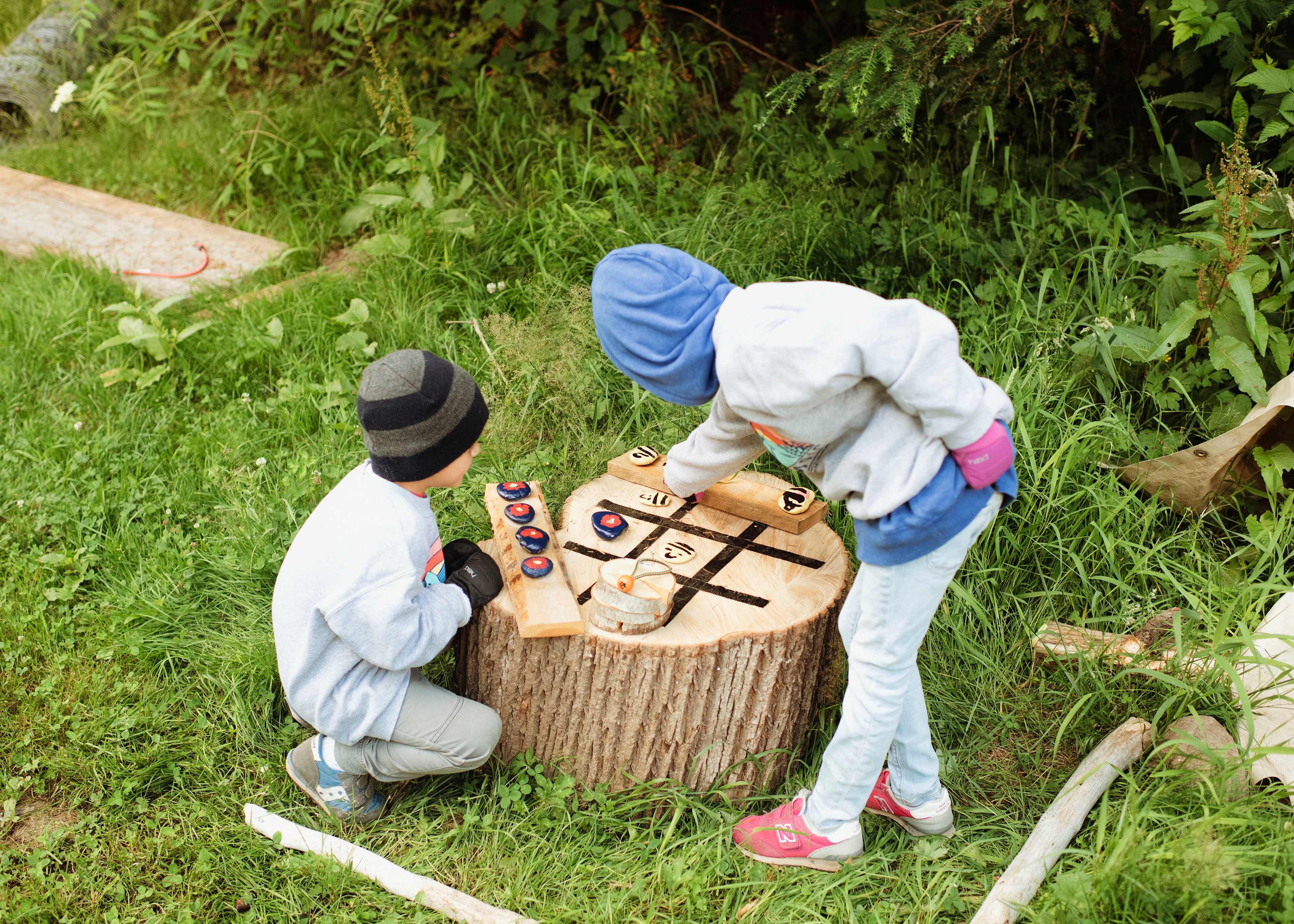 A wood and stone tic tac toe set is available for use.